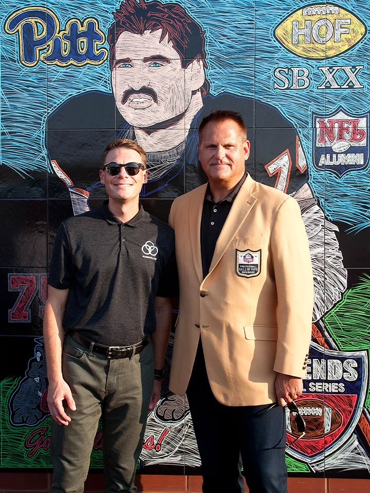 Aaron Cohn and Jimbo Covert in front of PPG-sponsored Mural