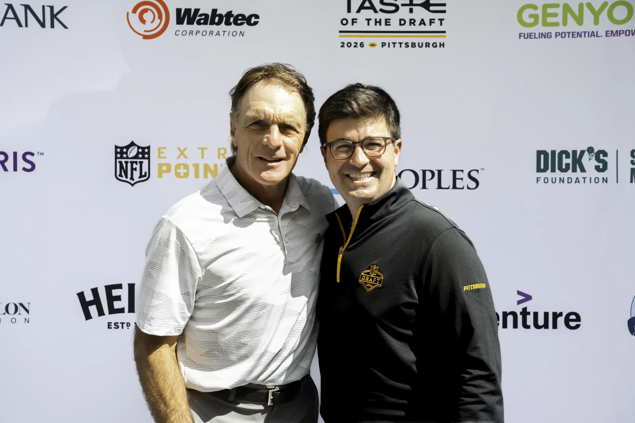 Doug Flutie & Mayor Corey O'Connor in front of Media Wall