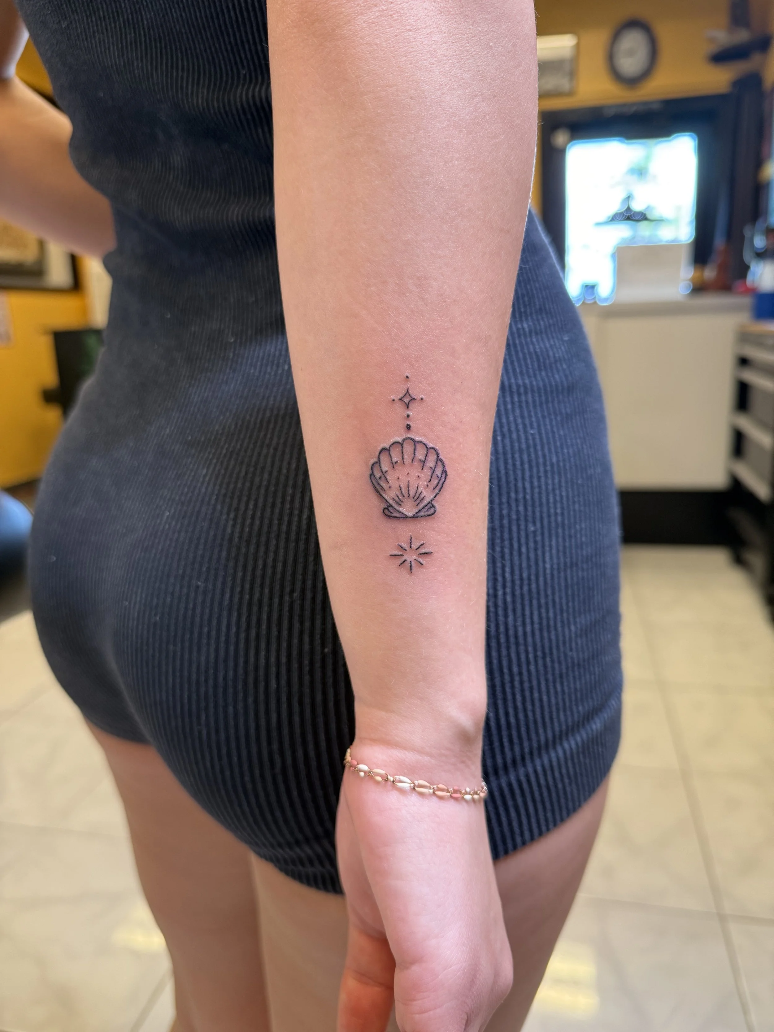 Fine Line Single Needle Shell Flash Monarch Tattoo Hawaii Custom.jpeg