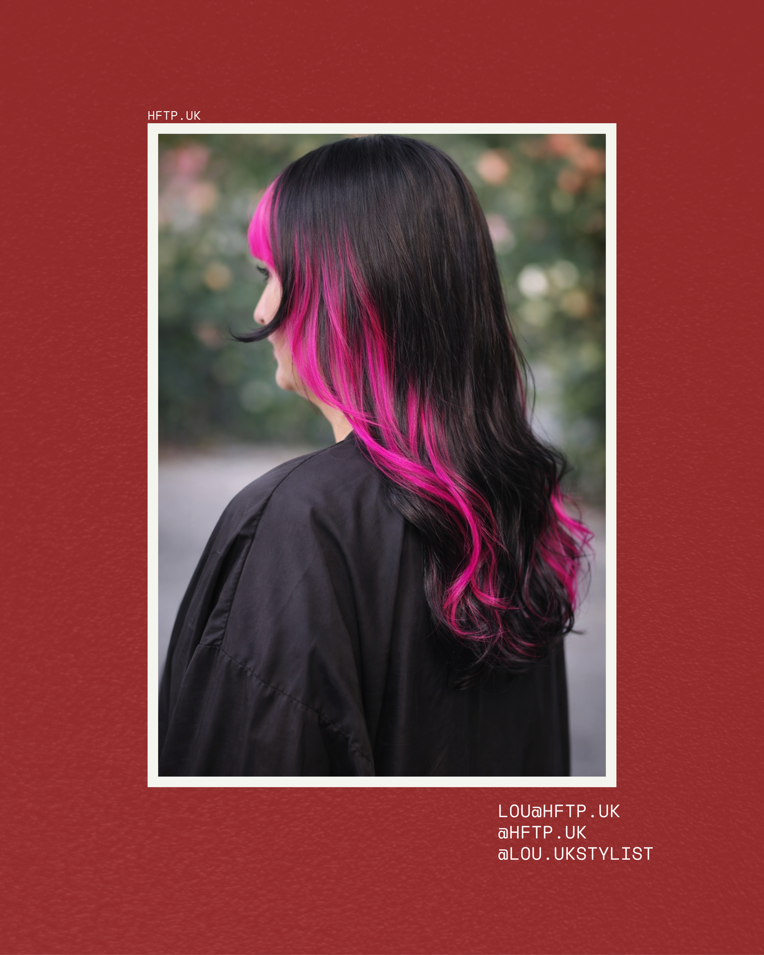 A woman with long hair dyed pink at the ends, seen from the side, outdoors with blurred greenery in the background.