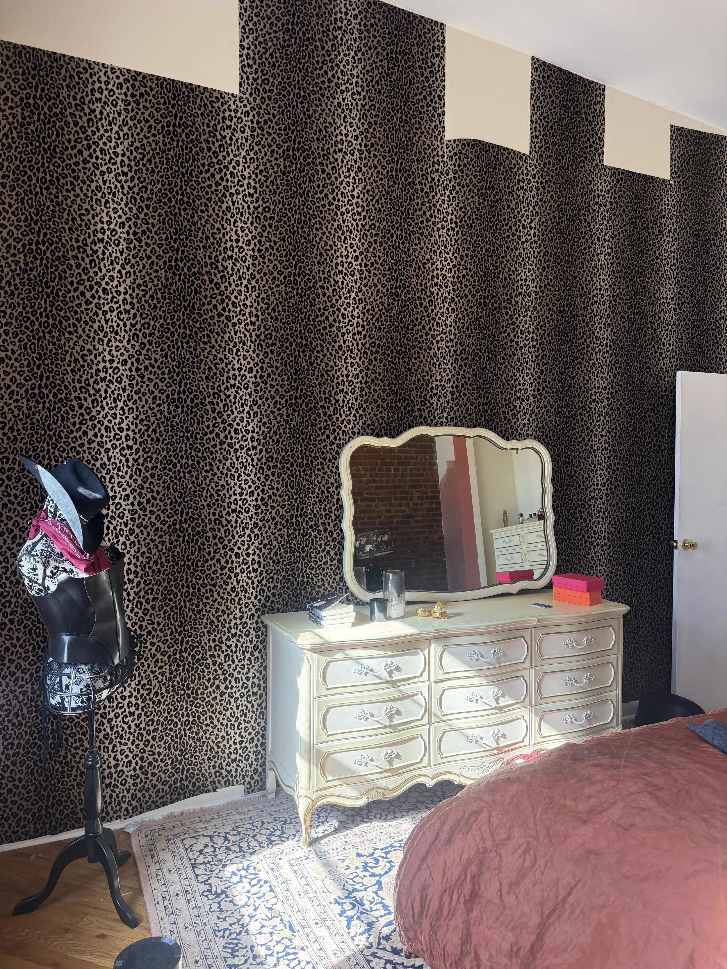 Leopard wall backdrop, dress form, vanity.jpg