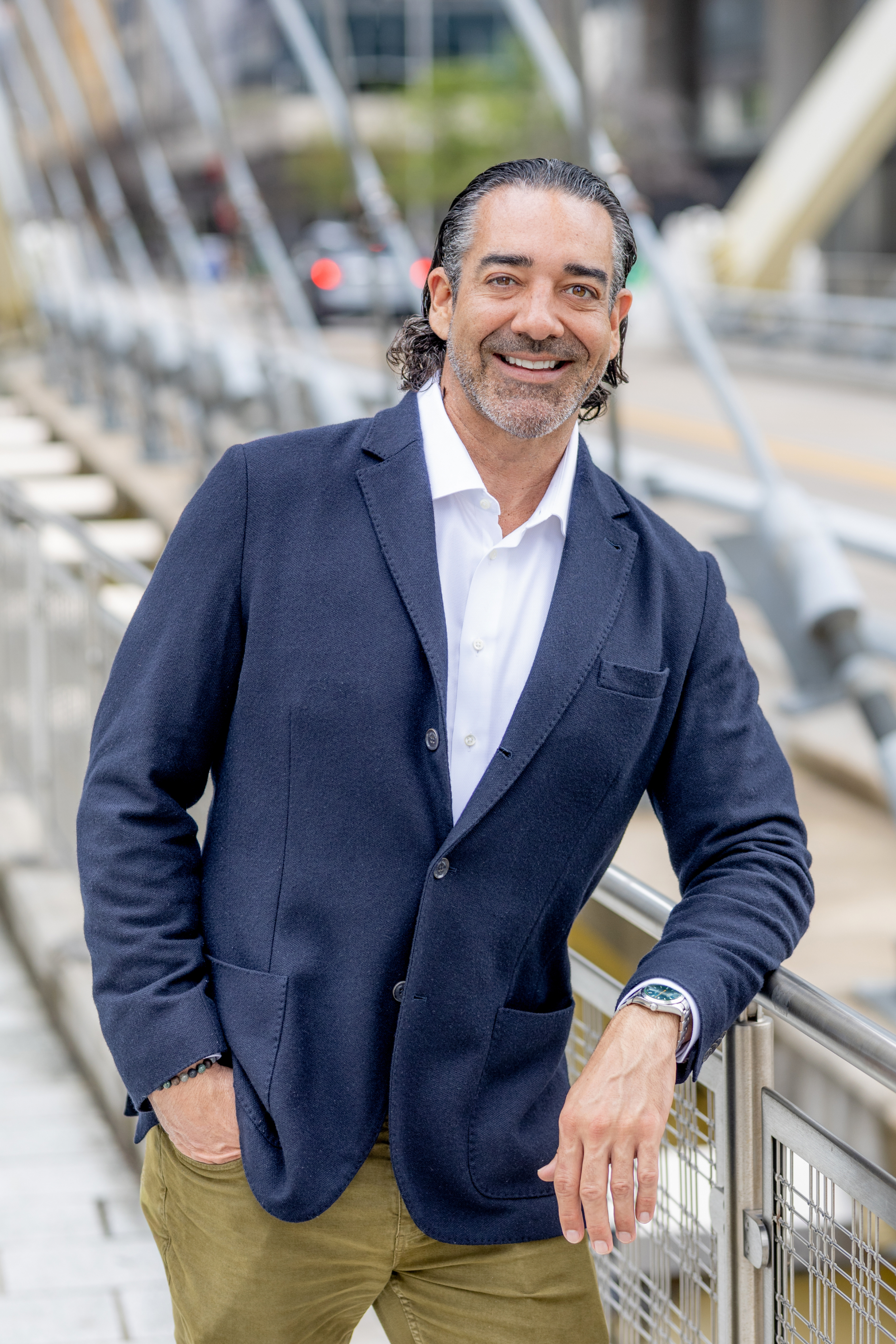 Sean Condon standing outdoors in a navy blazer smiling — Austin Texas mortgage specialist and founder of Condon Capital Group