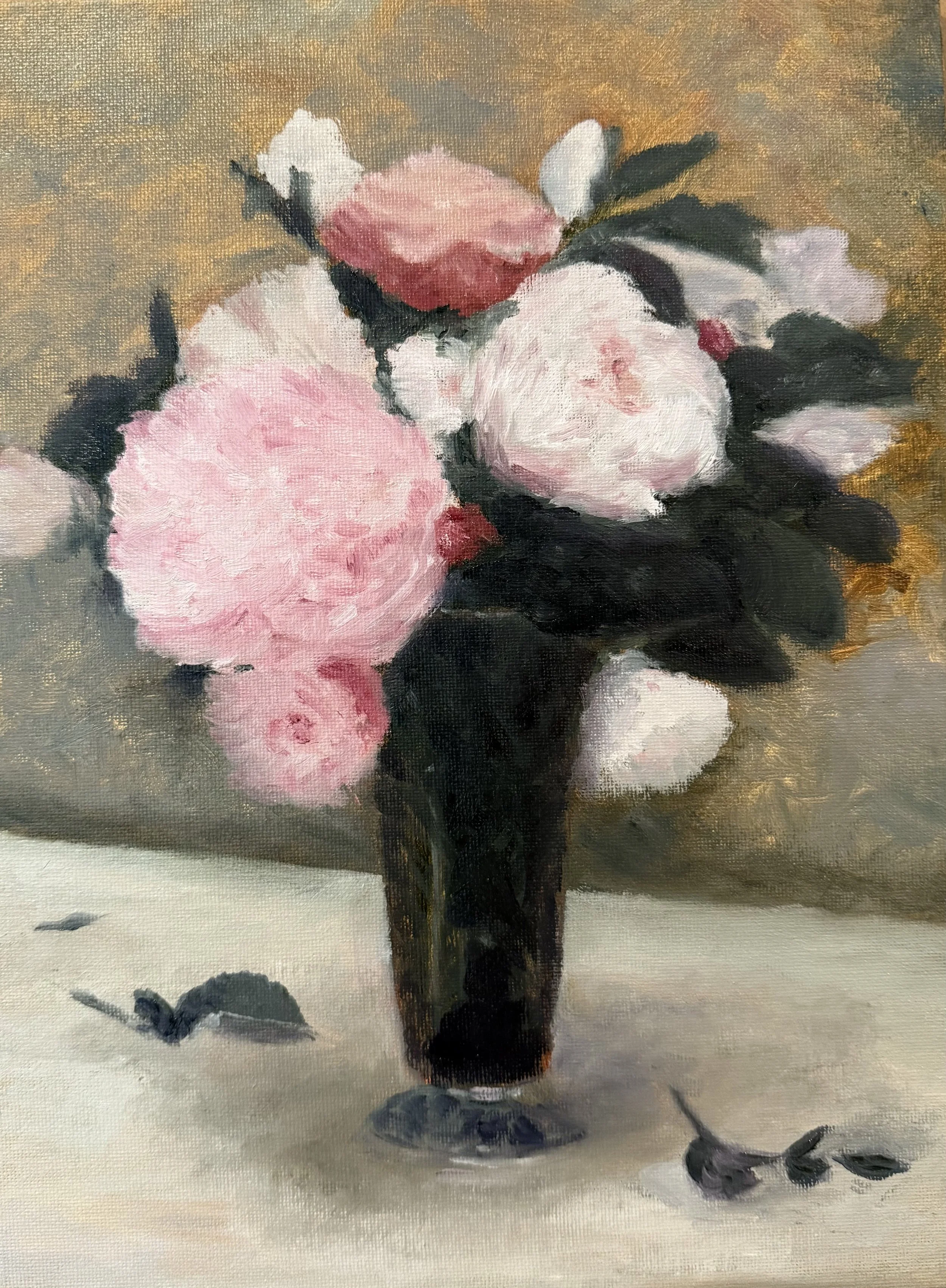 A still life painting of pink and white peonies in a dark glass vase on a table with a beige cloth, featuring a few fallen flower petals.