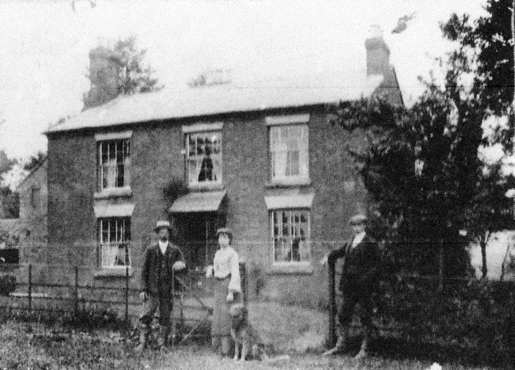 Marshalls farmhouse in 1913 - likely to be George and Ruby Savidge standing outside
