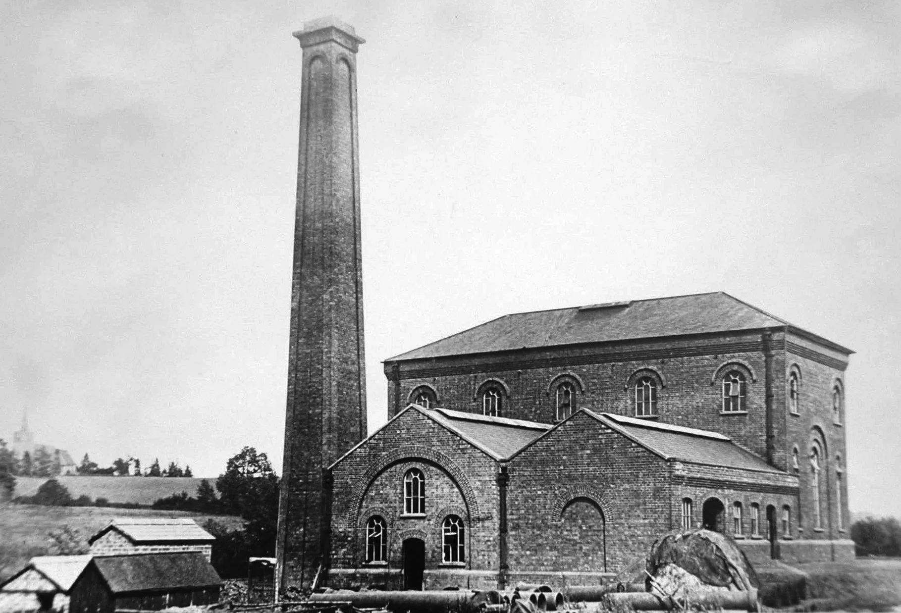 Newent Pumping Station with Oxenhall Church in the background