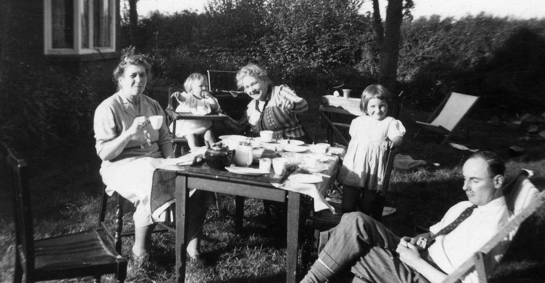 A tea party in the front garden at Church House, L-R: Mabel Strutt, Caroline Bendle, Jessie Calvert, Celia Bendle and Francis Bendle