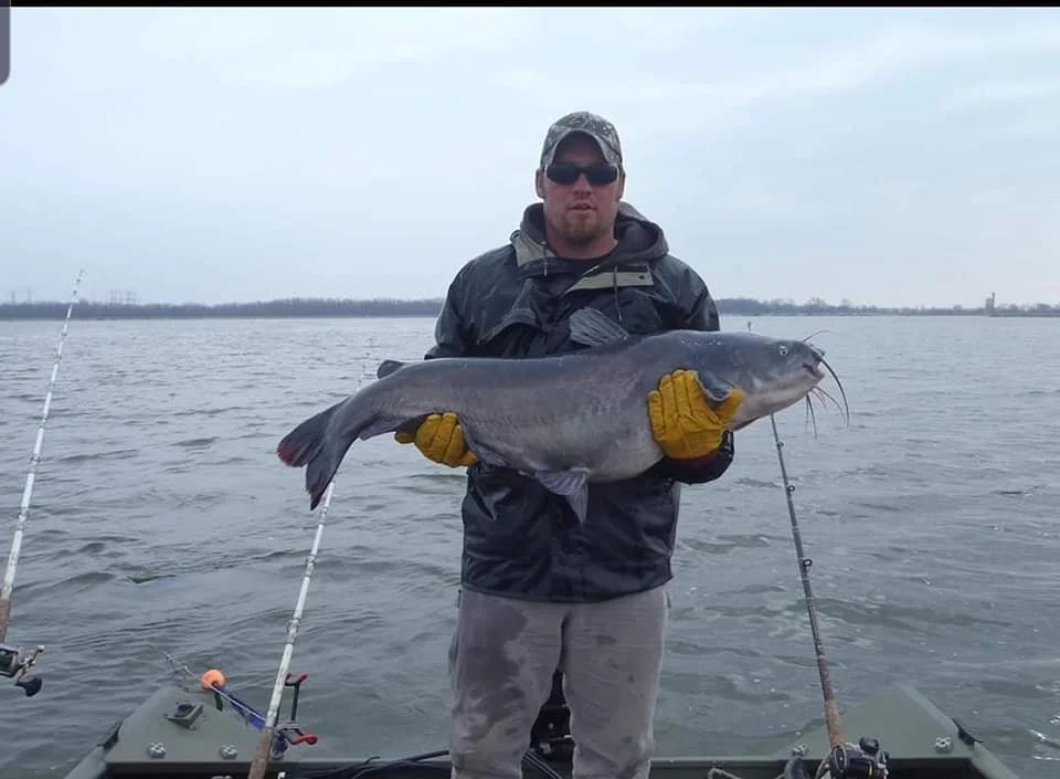 Bobby Lee holding a trophy catfish