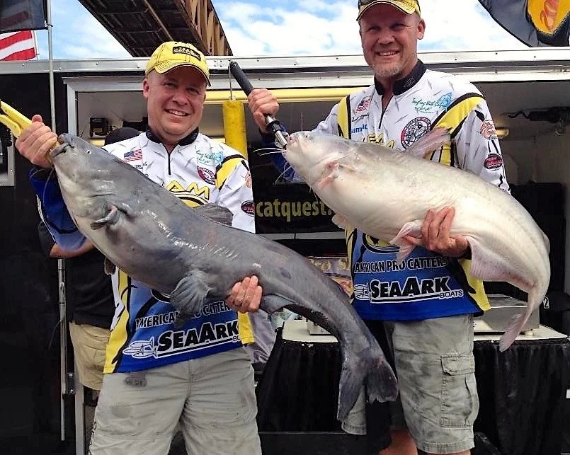 Pro anglers Jason and Daryl Masingale holding a trophy catfish