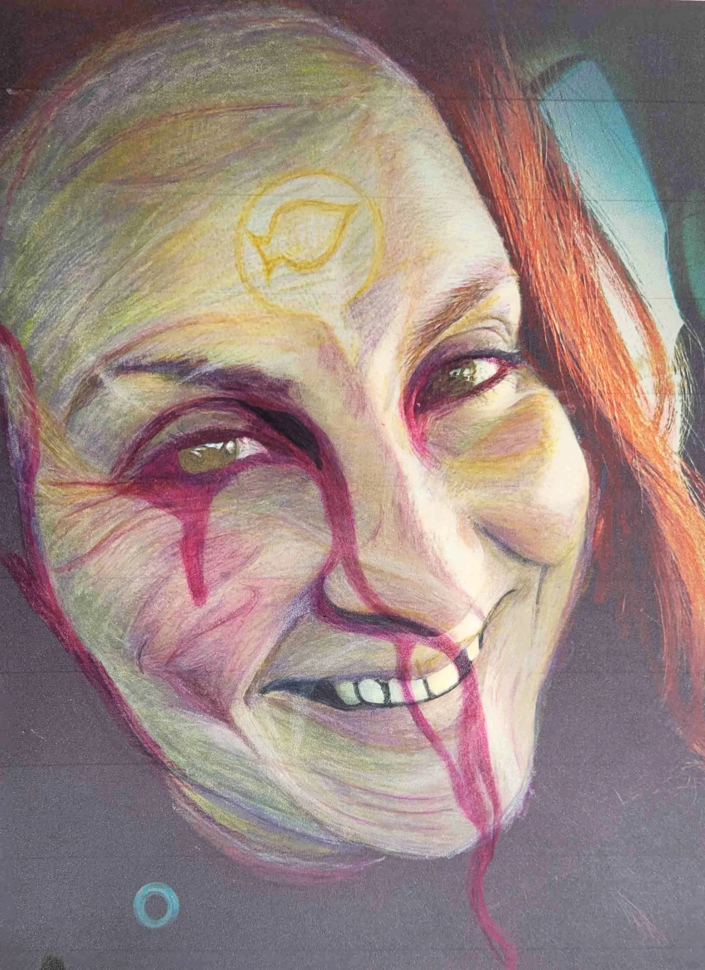 Close-up of a colorful portrait of a smiling woman with red hair, a painted yellow circle and leaf on her forehead, and red tears and blood running down her face against a dark background.