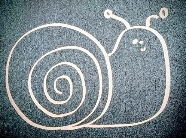 White chalk drawing of Felix the snail with a spiral shell and antennae on a dark surface.