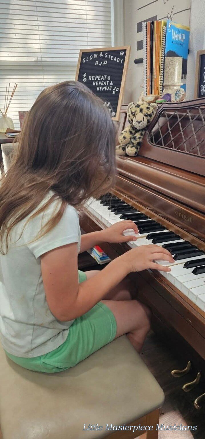 Little Masterpiece Musicians student practicing at the piano.