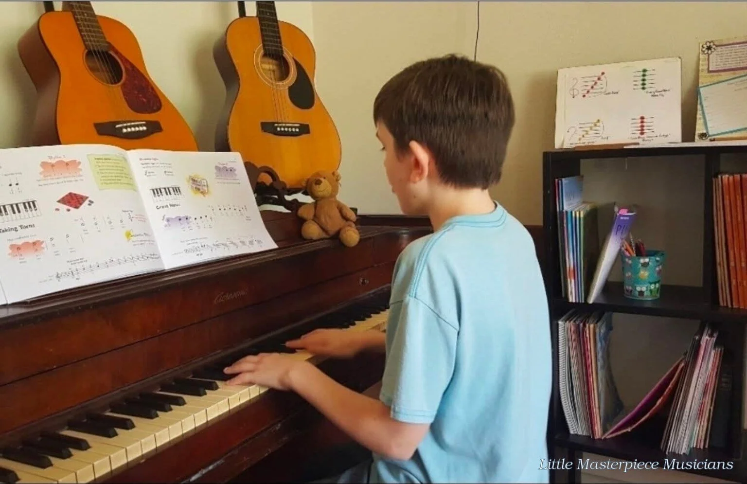Little Masterpiece Musicians student learning music at the piano.