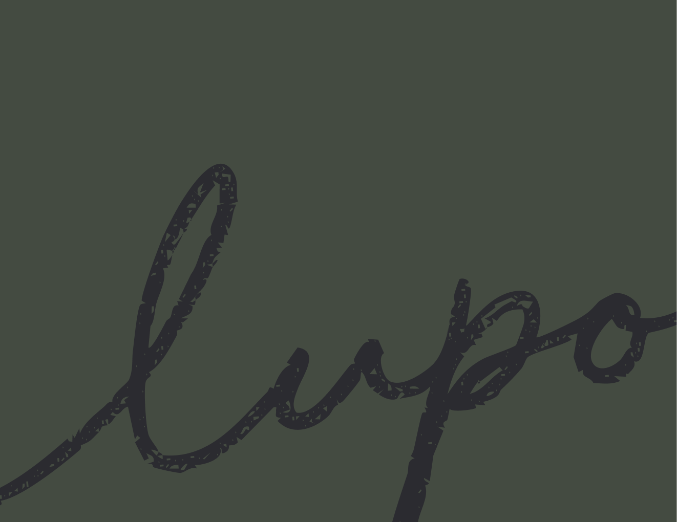 Close-up of the word 'Love' written in cursive with black ink on a dark green background.