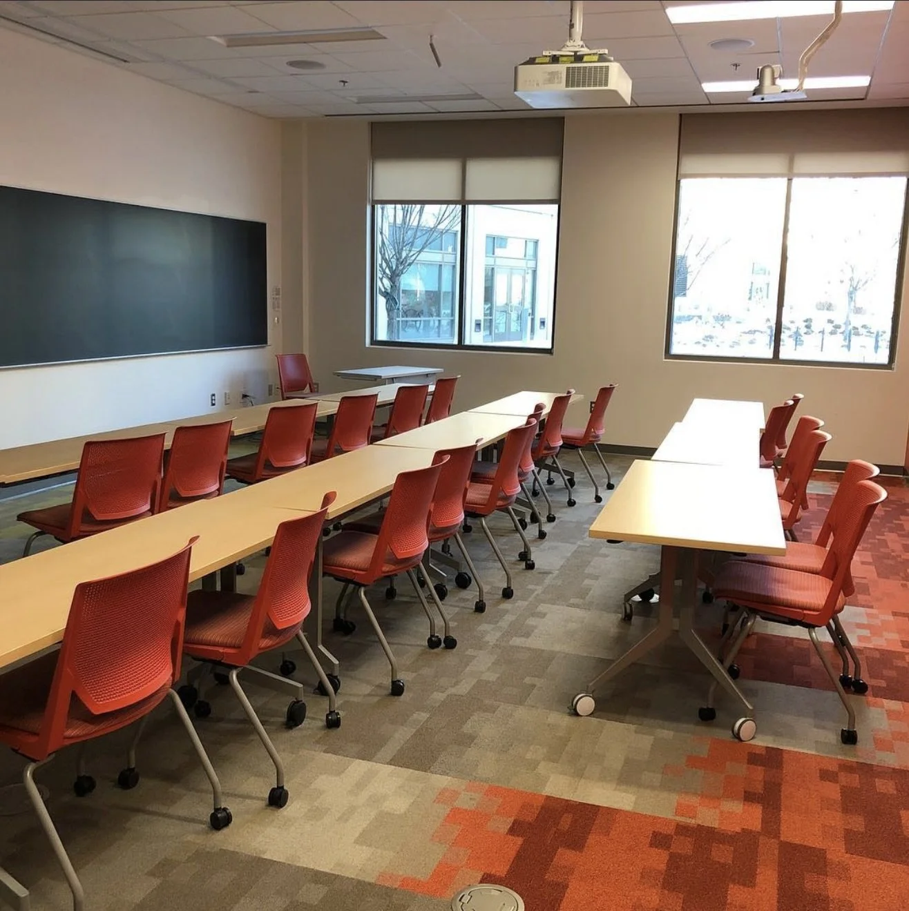 An empty classroom at American University, the exact classroom Olympia Georgeson taught as a professor in.