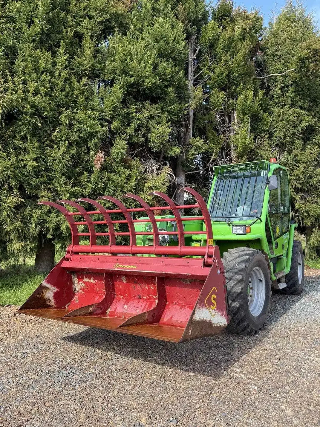 Merlo P34.7 telehandler fitted with Strautmann hydraulic grab bucket