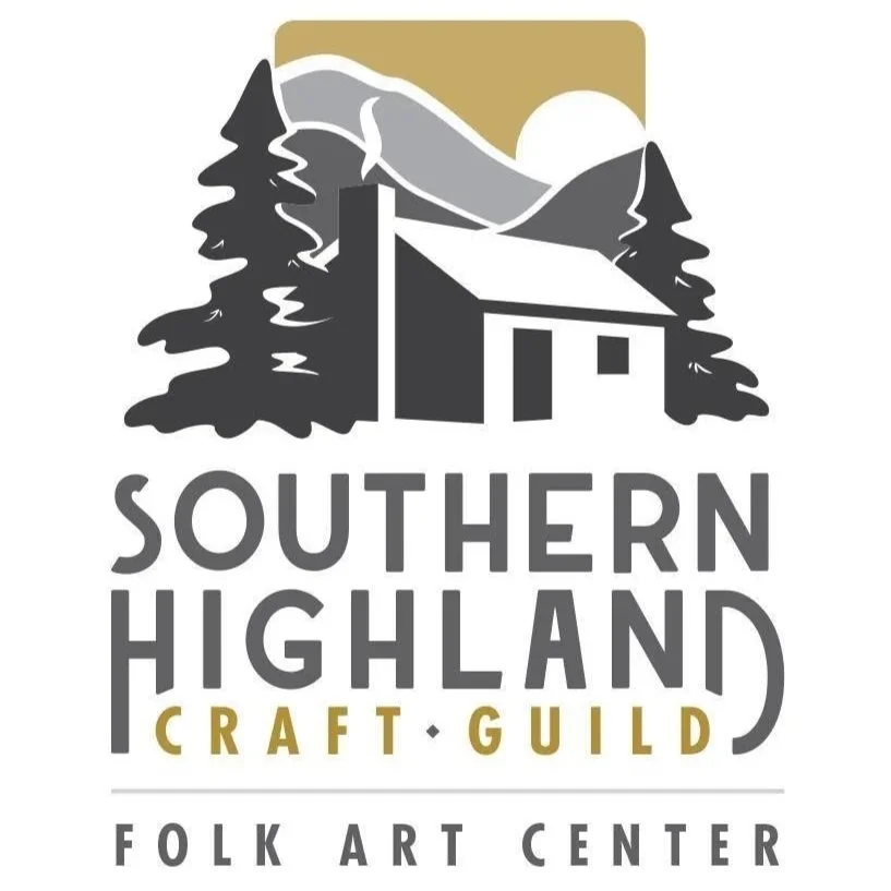 Logo for Southern Highland Craft Guild Folk Art Center, featuring a mountain landscape with trees, a cabin, and the sun or moon.
