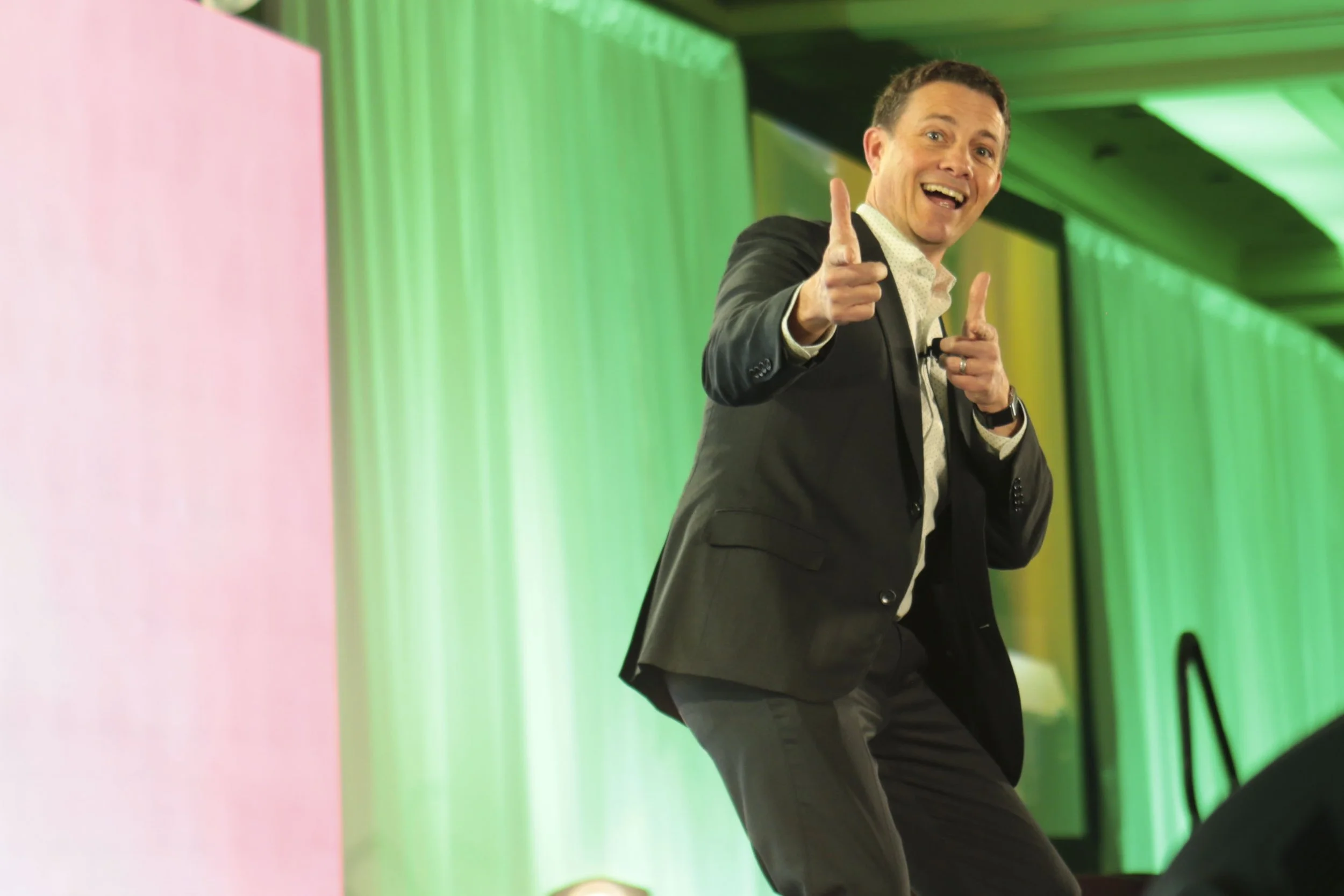 Jeff Toister smiling and facing the camera, pointing two fingers in a silly gesture.