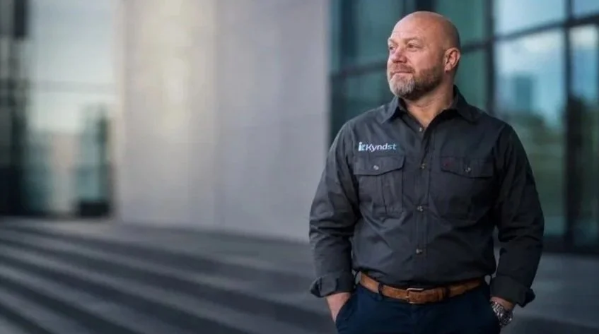 Mike Hamilton stood outside office with hands in pockets