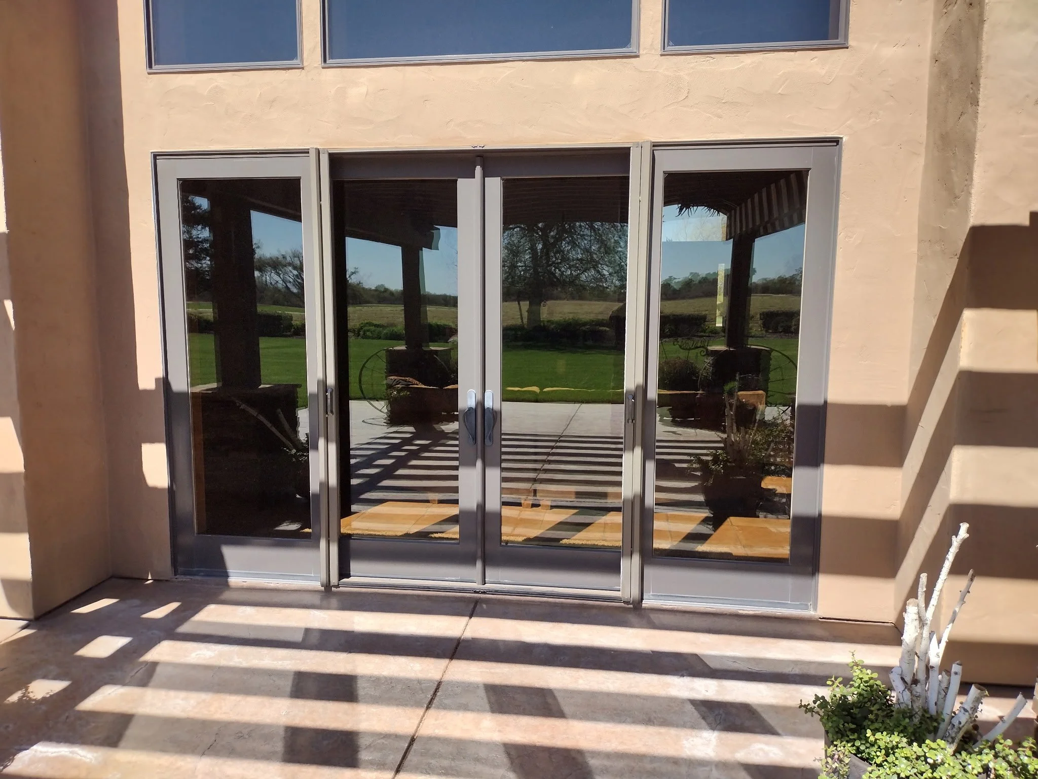 Double Legacy Screen doors  with color match mounted on the center panels on a 4 Panel Door System