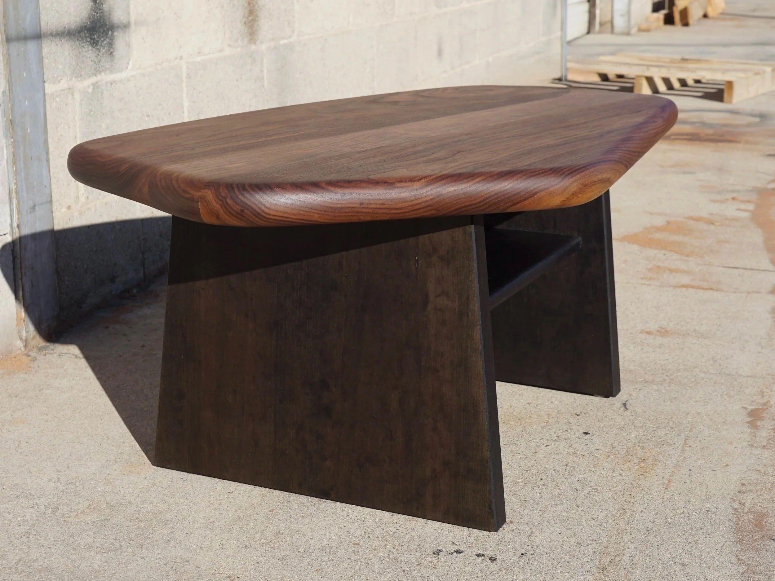 Custom coffee table in walnut, organic shape