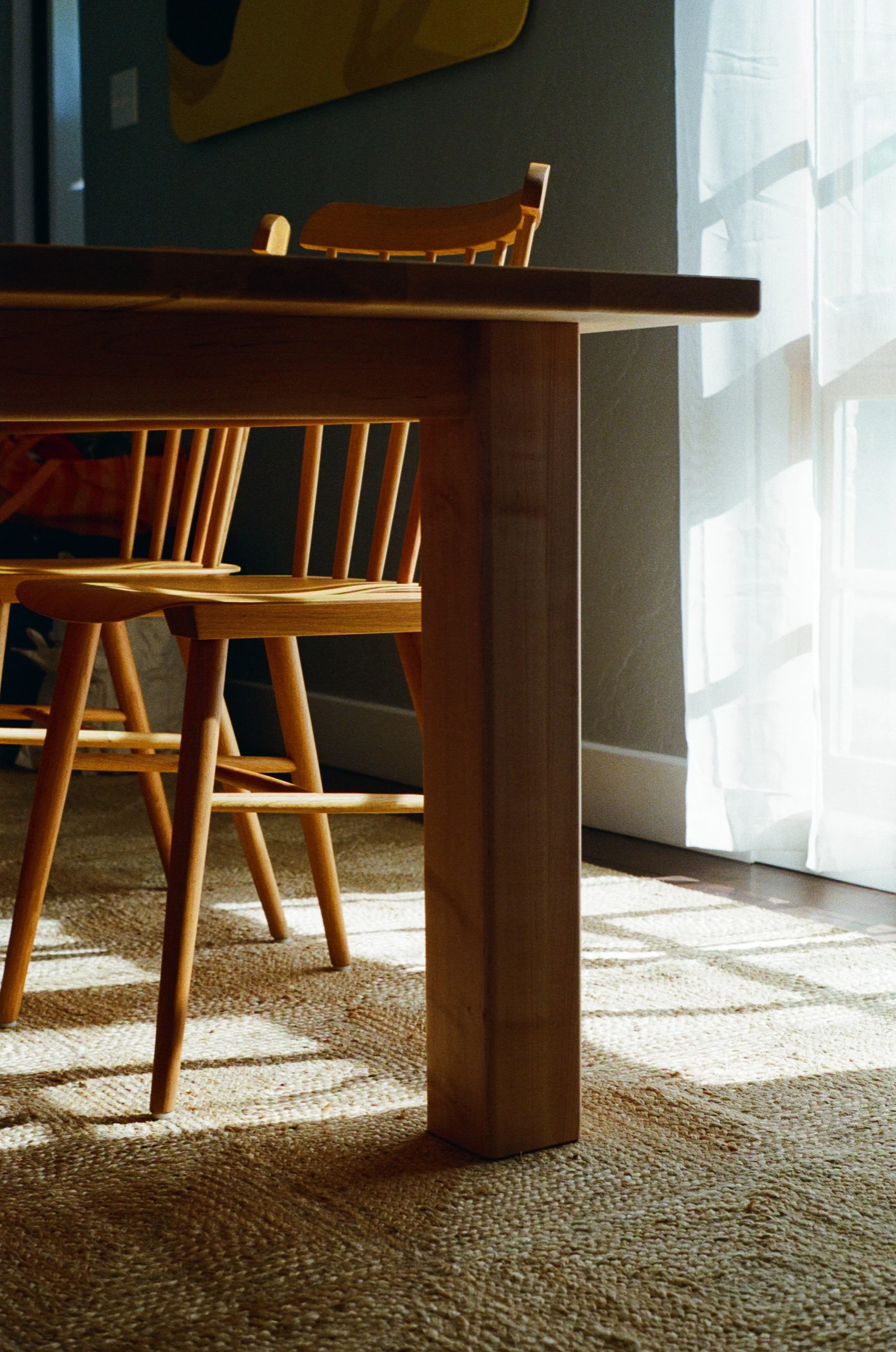 Custom maple dining table in maple with chairs