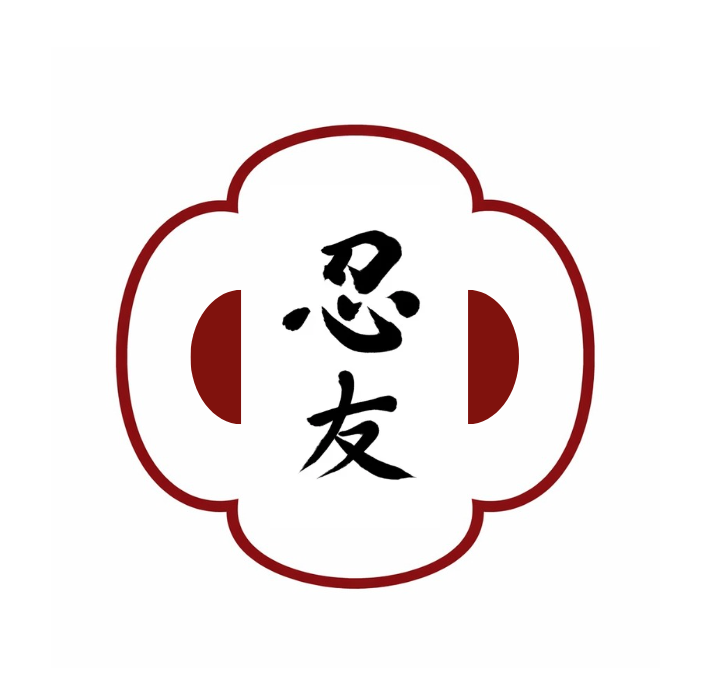 A mokko-gata style tsuba outline with black kanji characters in the center, all dark red