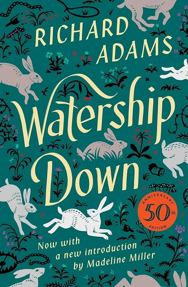 The book cover for 'Watership Down' by Richard Adams features illustrations of white rabbits and various plants on a teal background, with a red circle indicating the 50th anniversary edition.