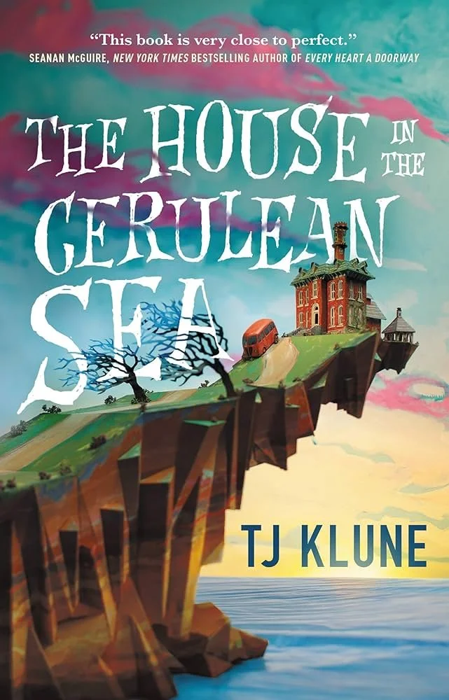 Book cover for "The House in the Gerulean Sea" by TJ Klune featuring a floating island with a house, trees, and a bus, with the ocean below and a colorful sky in the background.