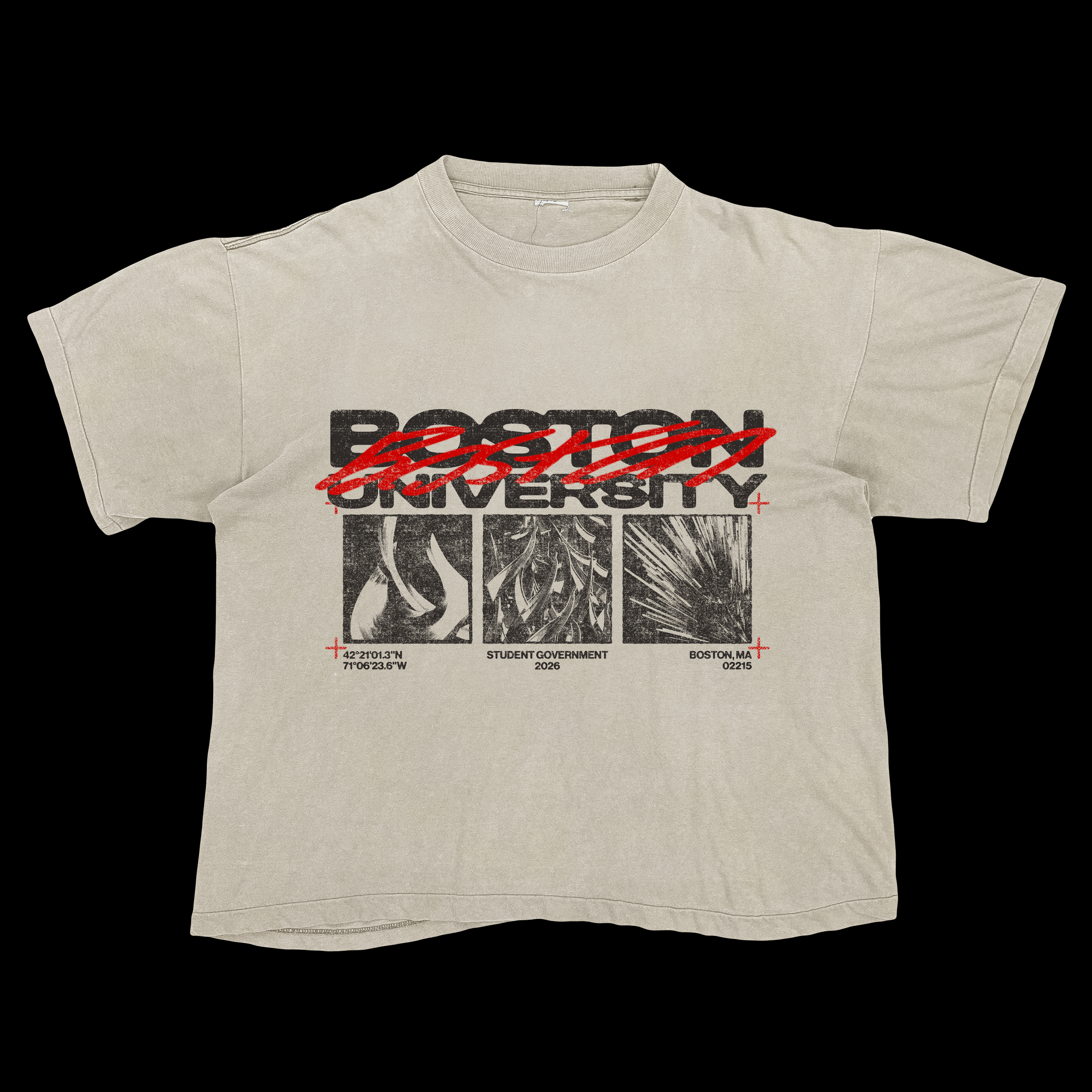 A beige T-shirt with a design that has the text 'POW' crossed out in red, 'BOSTON' written underneath, and below that 'UNIVERSITY' in capital letters. Coordinates and additional text are printed at the bottom.