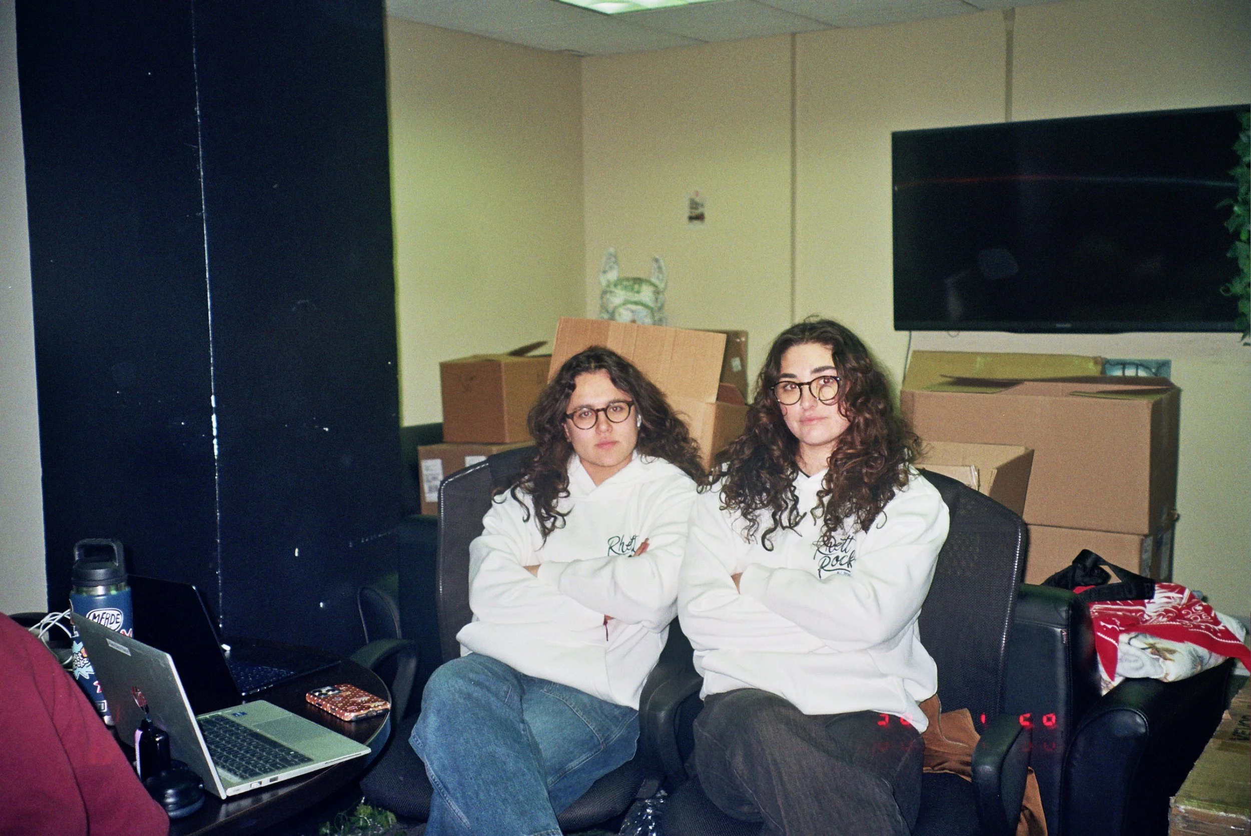 Head of Video Duru, and Chief of Staff Alara matching in the office during RhettRockz all-hands meeting
