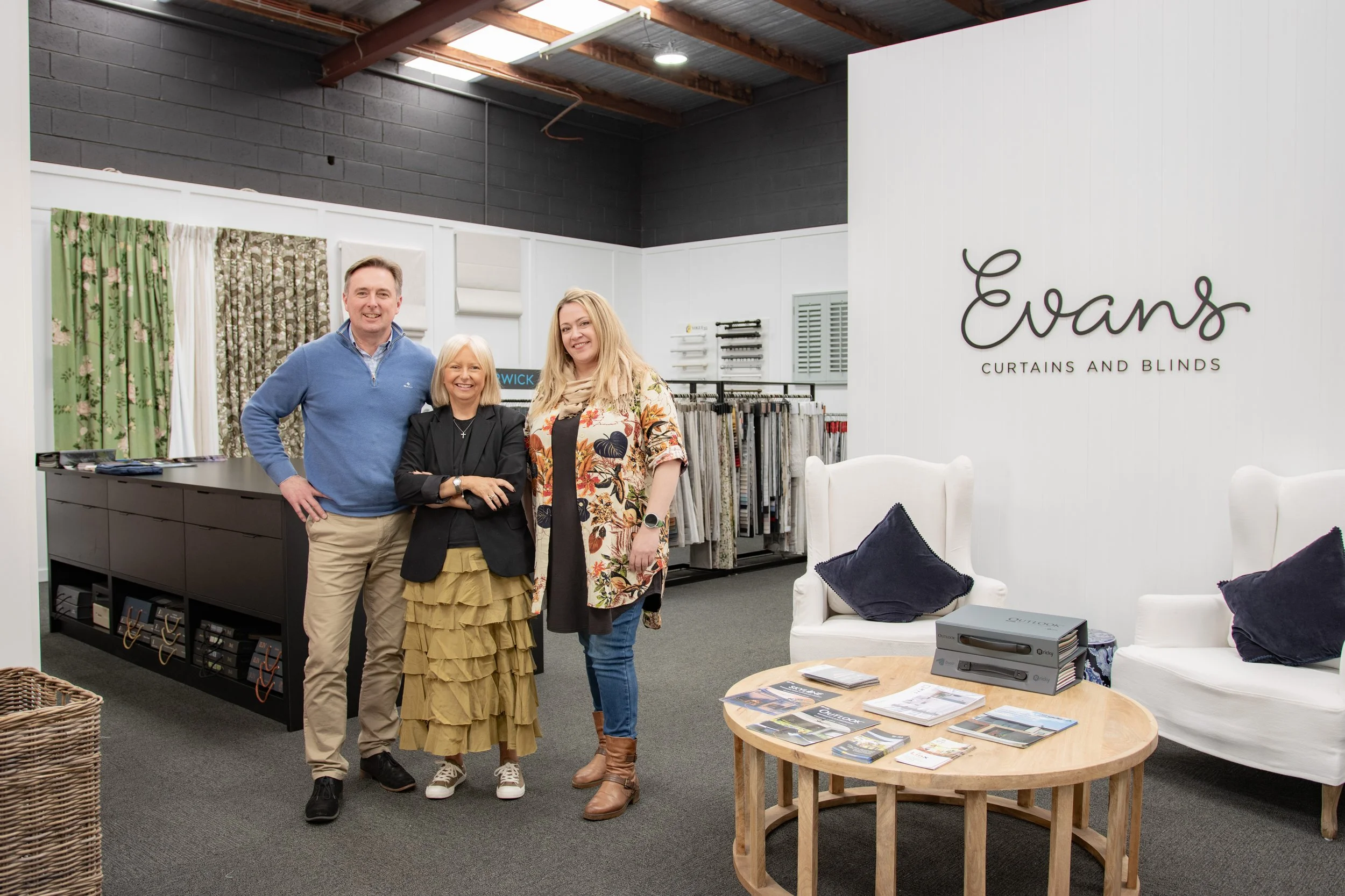 The Evans Curtains and Blinds team in their Melbourne showroom, helping customers find the right window furnishings for their home.