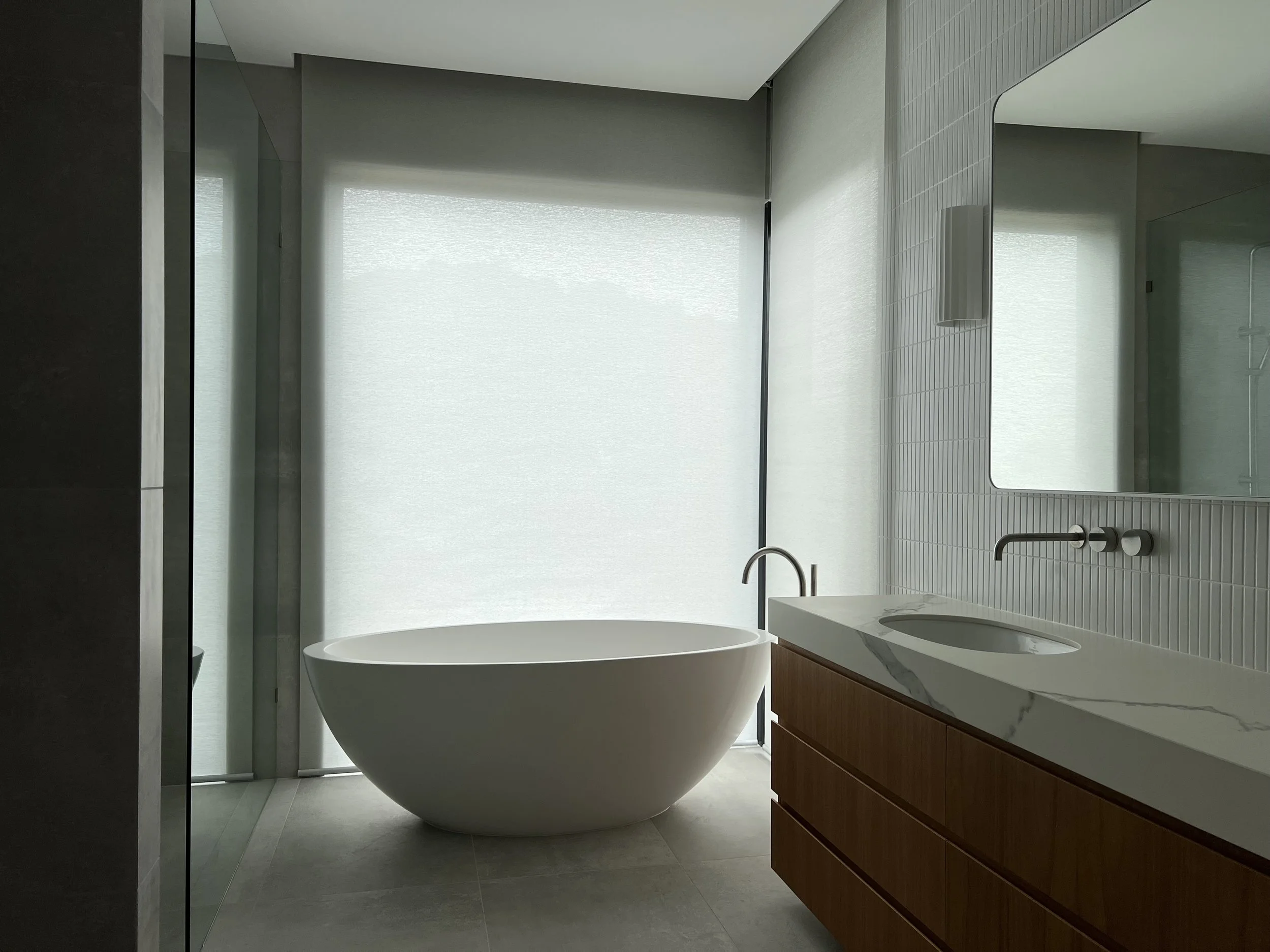 Bathroom blinds by Evans Curtains and Blinds, providing privacy and light control in a modern bathroom.