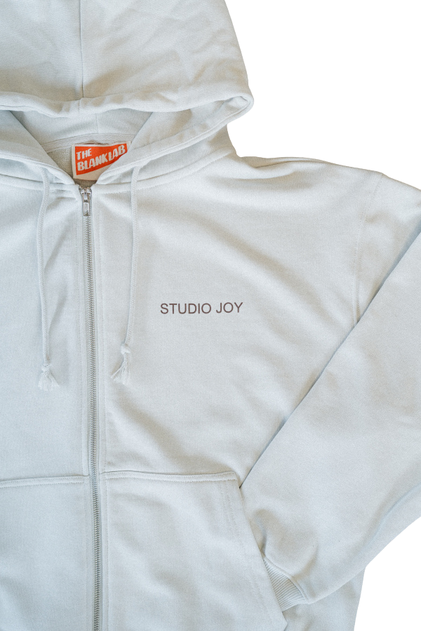 zip hoodie white background close up.png