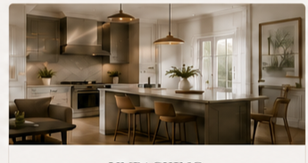 Modern kitchen with a large island, pendant lights, wooden chairs, and plants near windows.