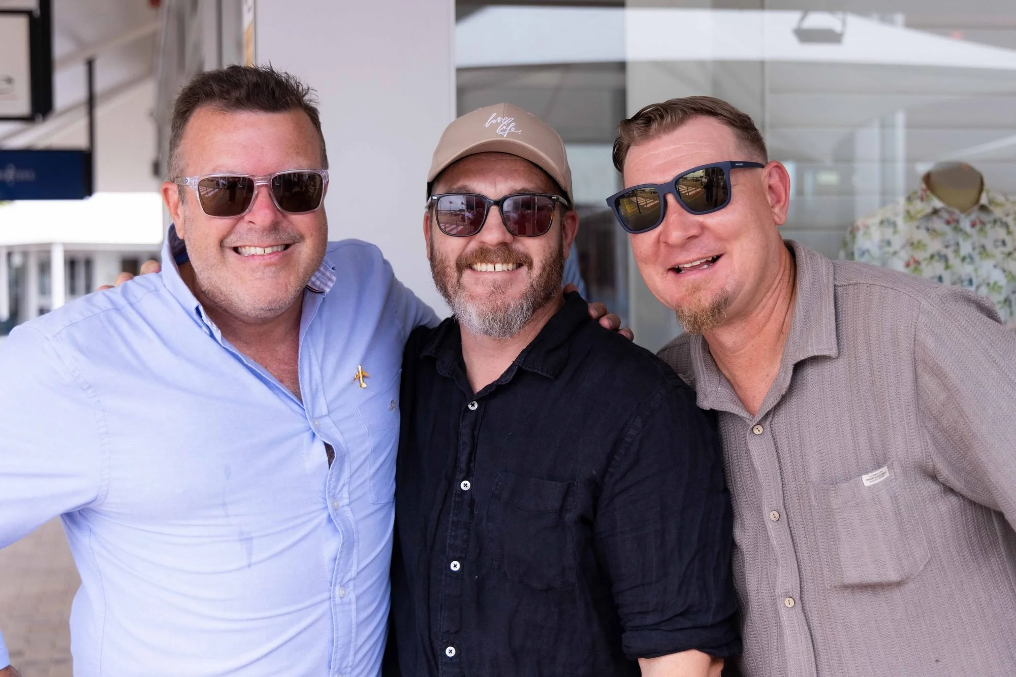 Three friends smiling together at The Rolling Lunch 2026