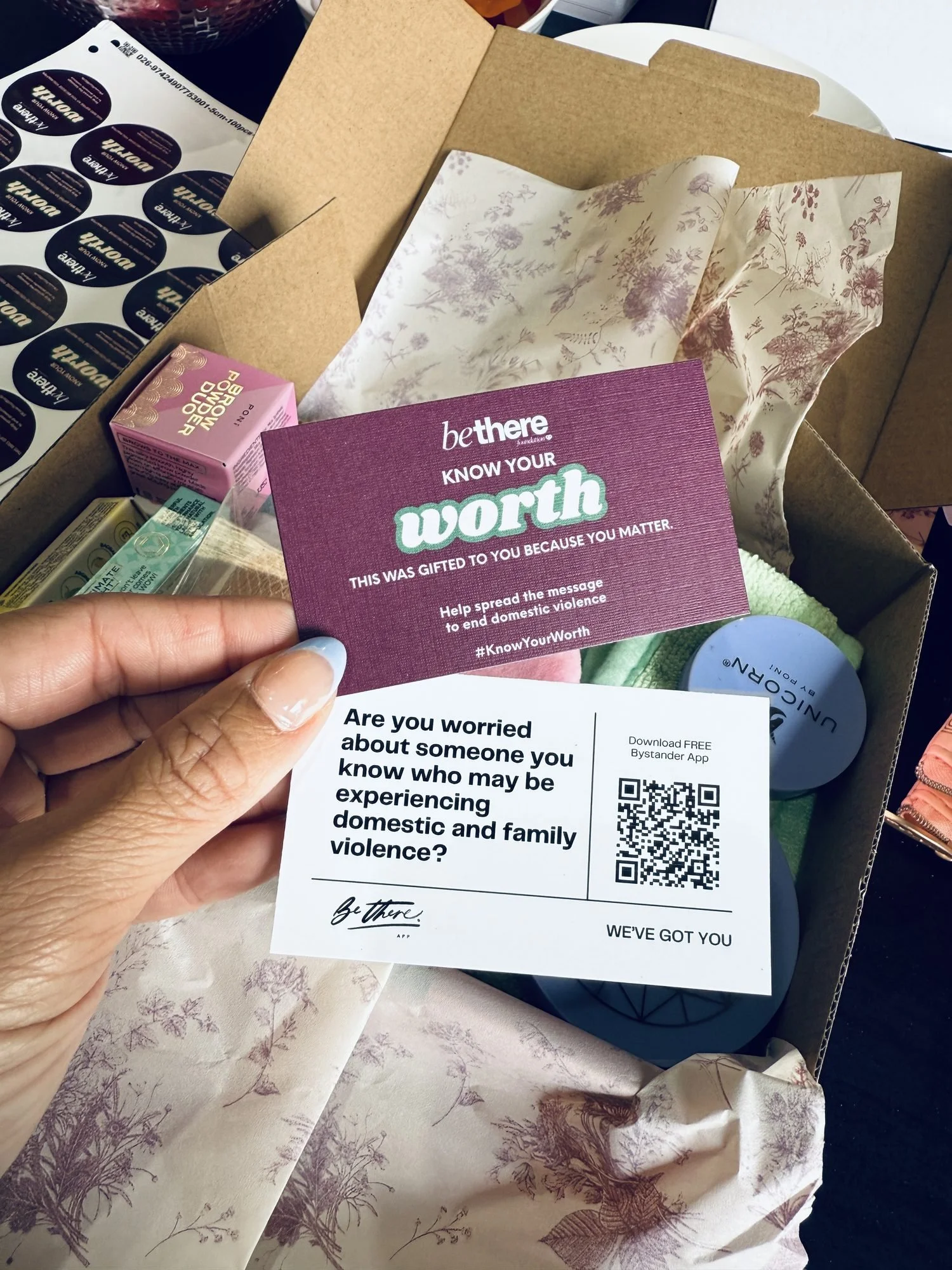 A Know Your Worth campaign card ready to be placed in a pack