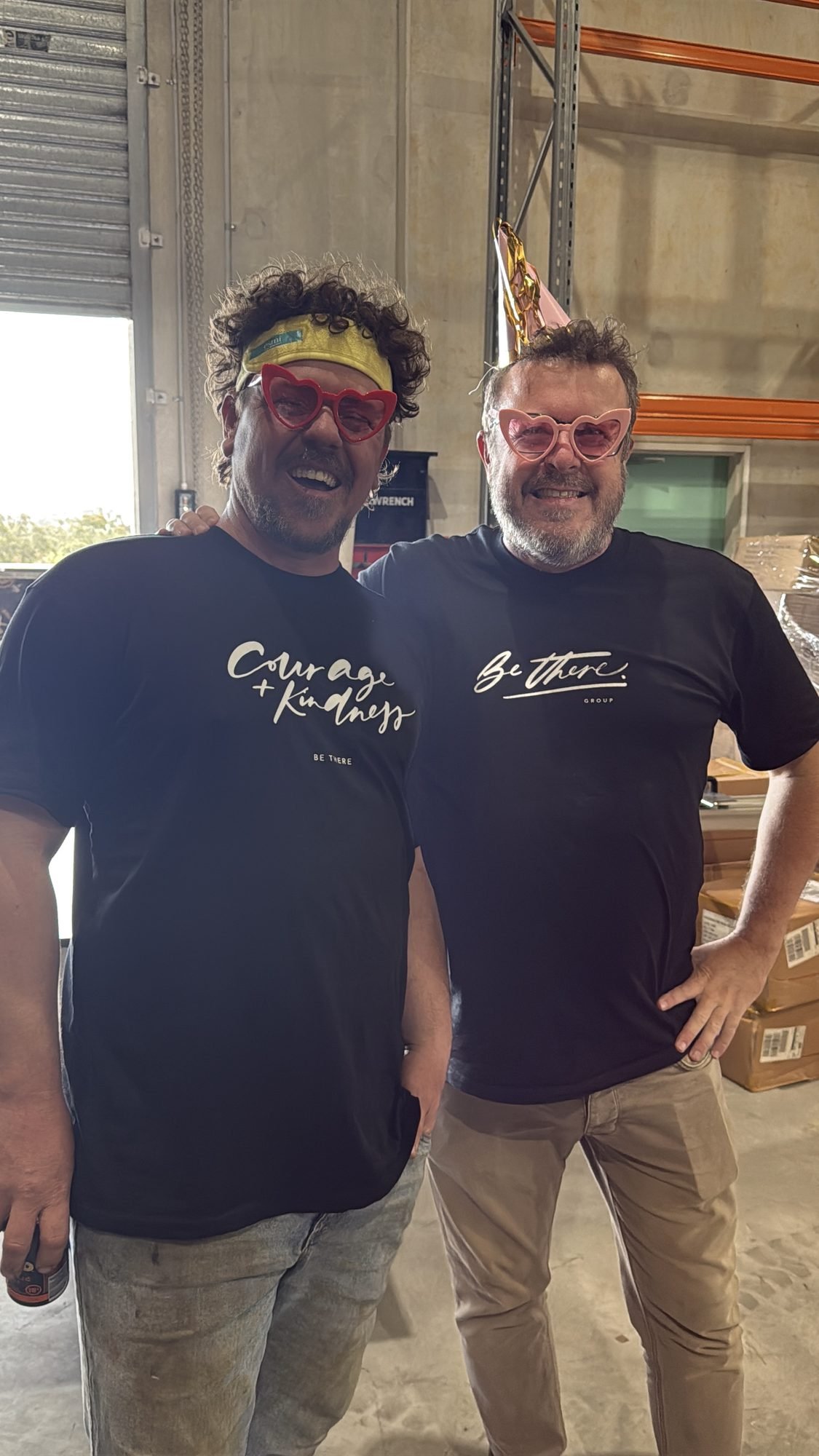 Two volunteers smiling together at the Volunteer Packing Day