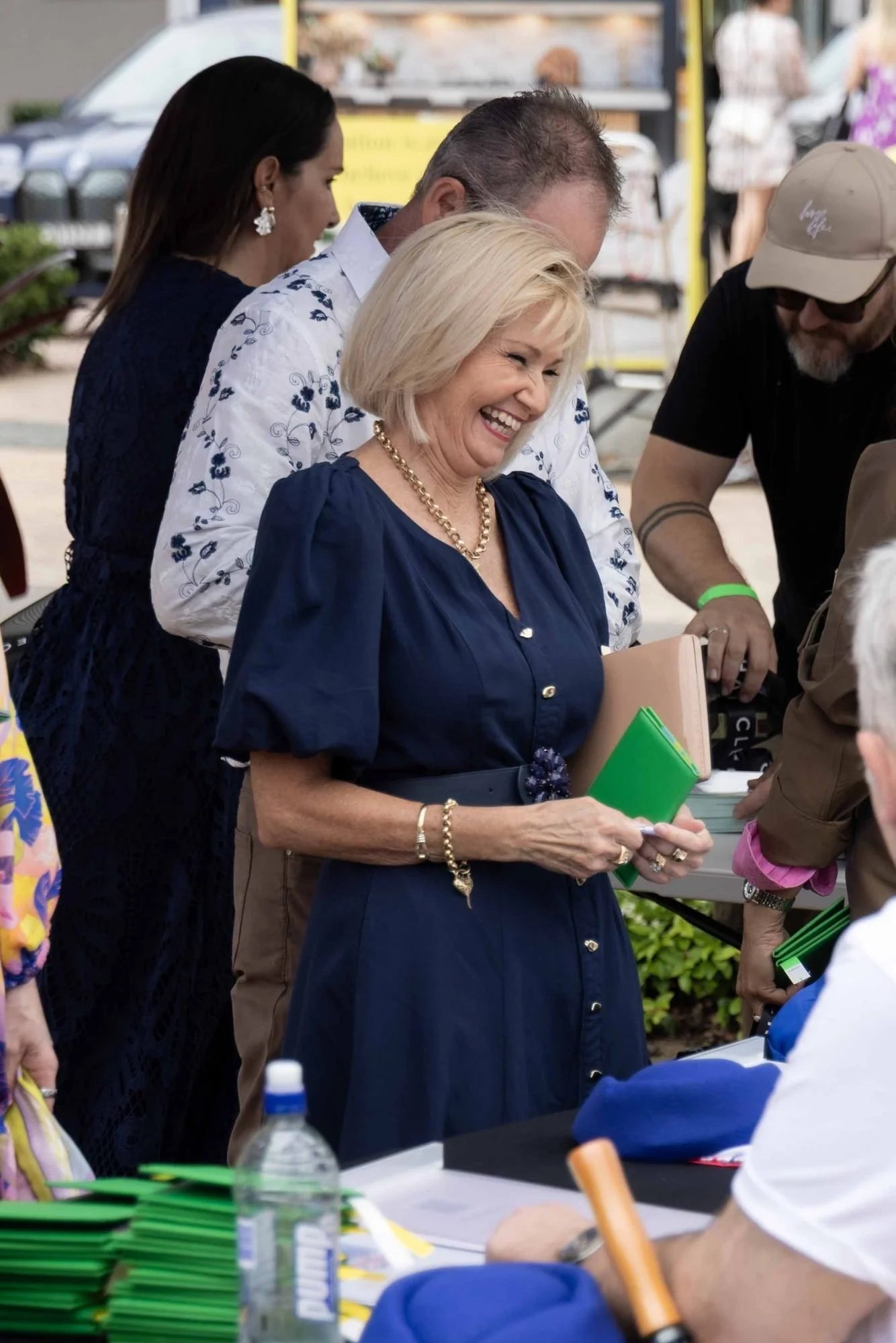 Guests laughing at the registration table at The Rolling Lunch 2026