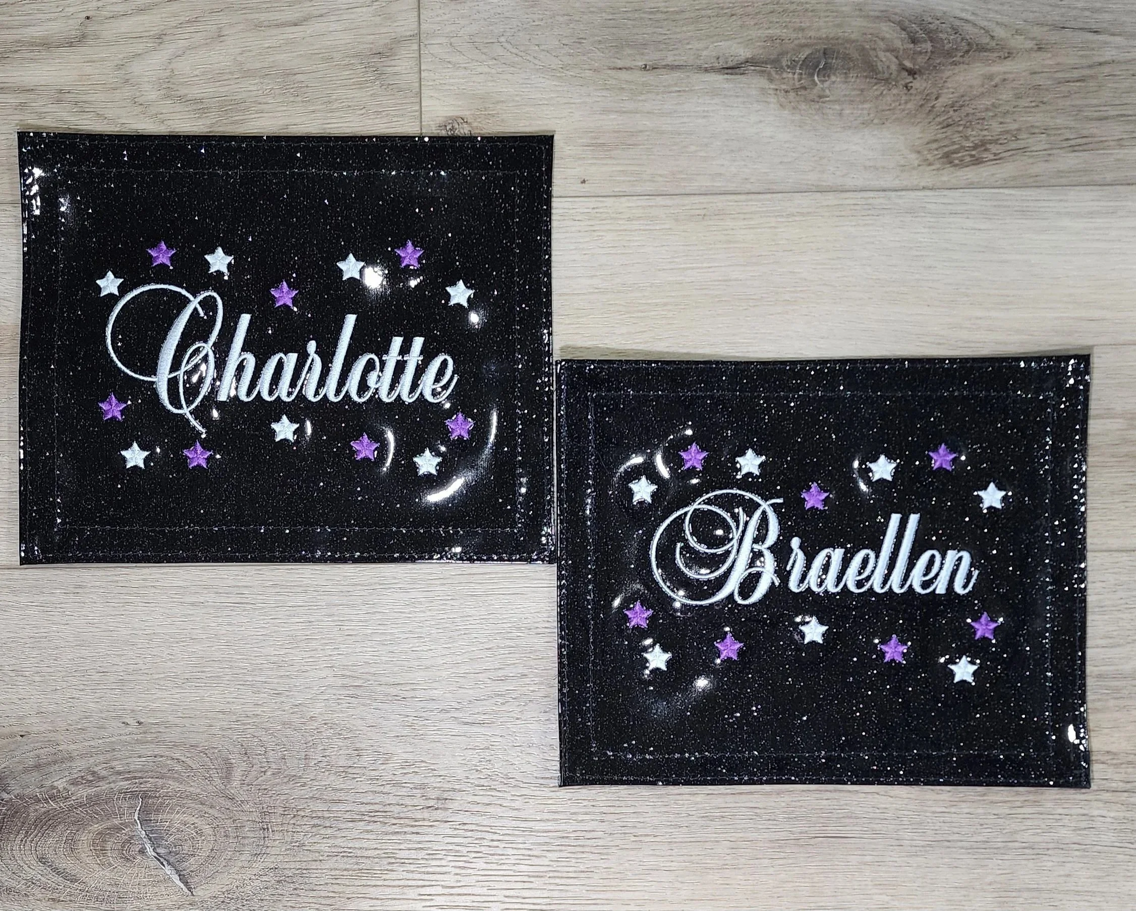 two dance patches with embroidered names in white and stars in white and purple