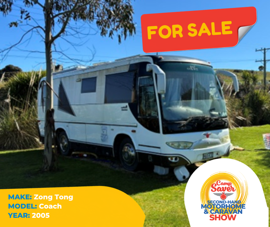 A 2005 Zong Tong coach motorhome for sale parked on a grassy area with trees and clear blue sky in the background. A red 'For Sale' sign is displayed at the top right of the image, and a logo for 'Camp Saver Second-Hand Motorhome & Caravan Show' is in the bottom right corner.