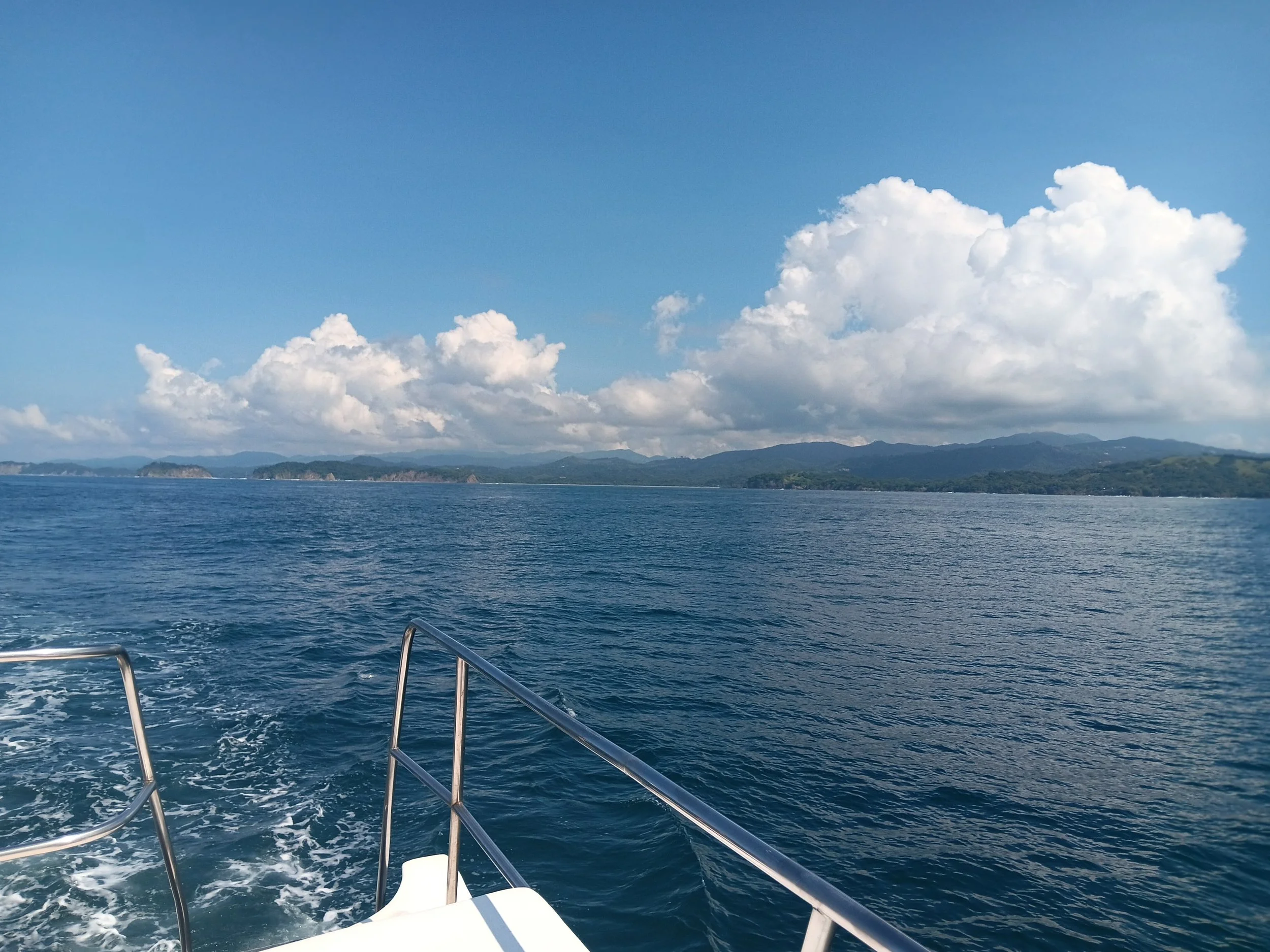 Open sea with coastal view from a boat