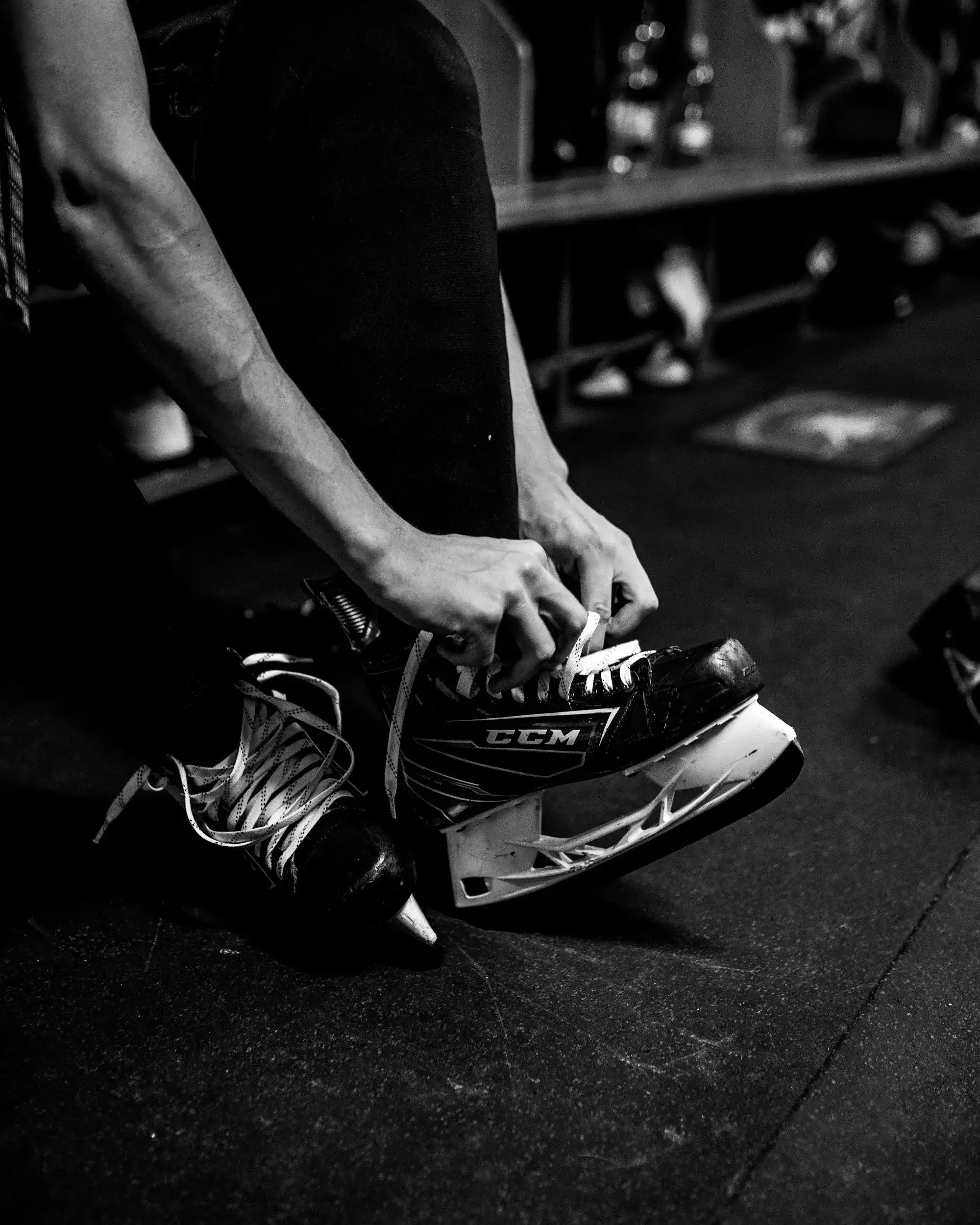 Man tying hockey skates