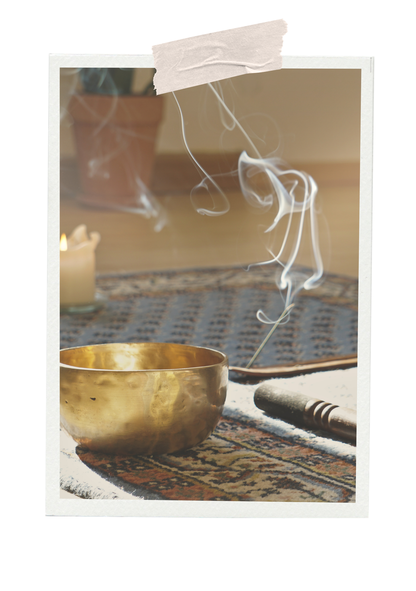 A singing bowl on a decorative cloth with a lit candle nearby, and incense smoke rising from an incense stick.