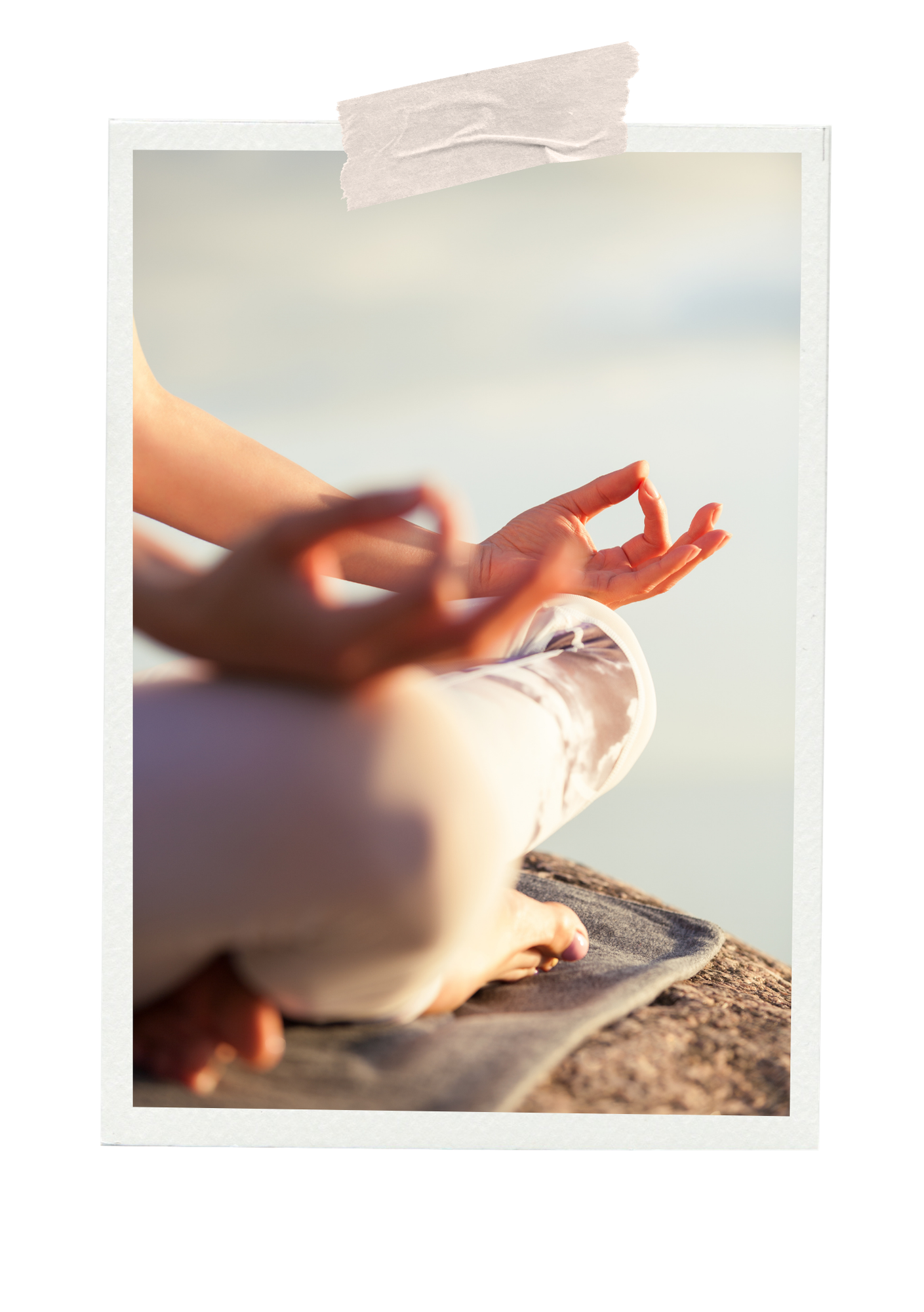 Person practicing yoga or meditation outdoors by the water, sitting cross-legged on a mat with hands in a mudra position.