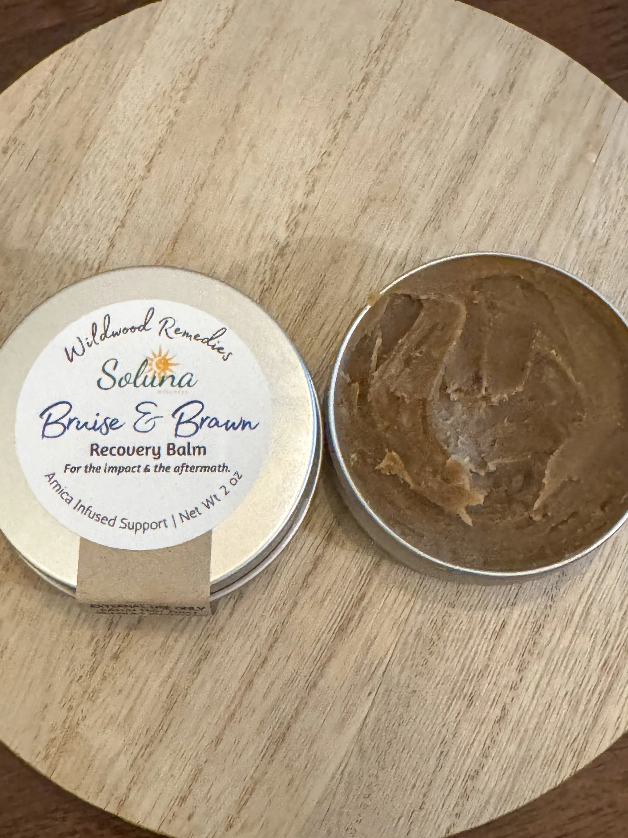 Infused arnica recovery balm by Soluna Wellness.