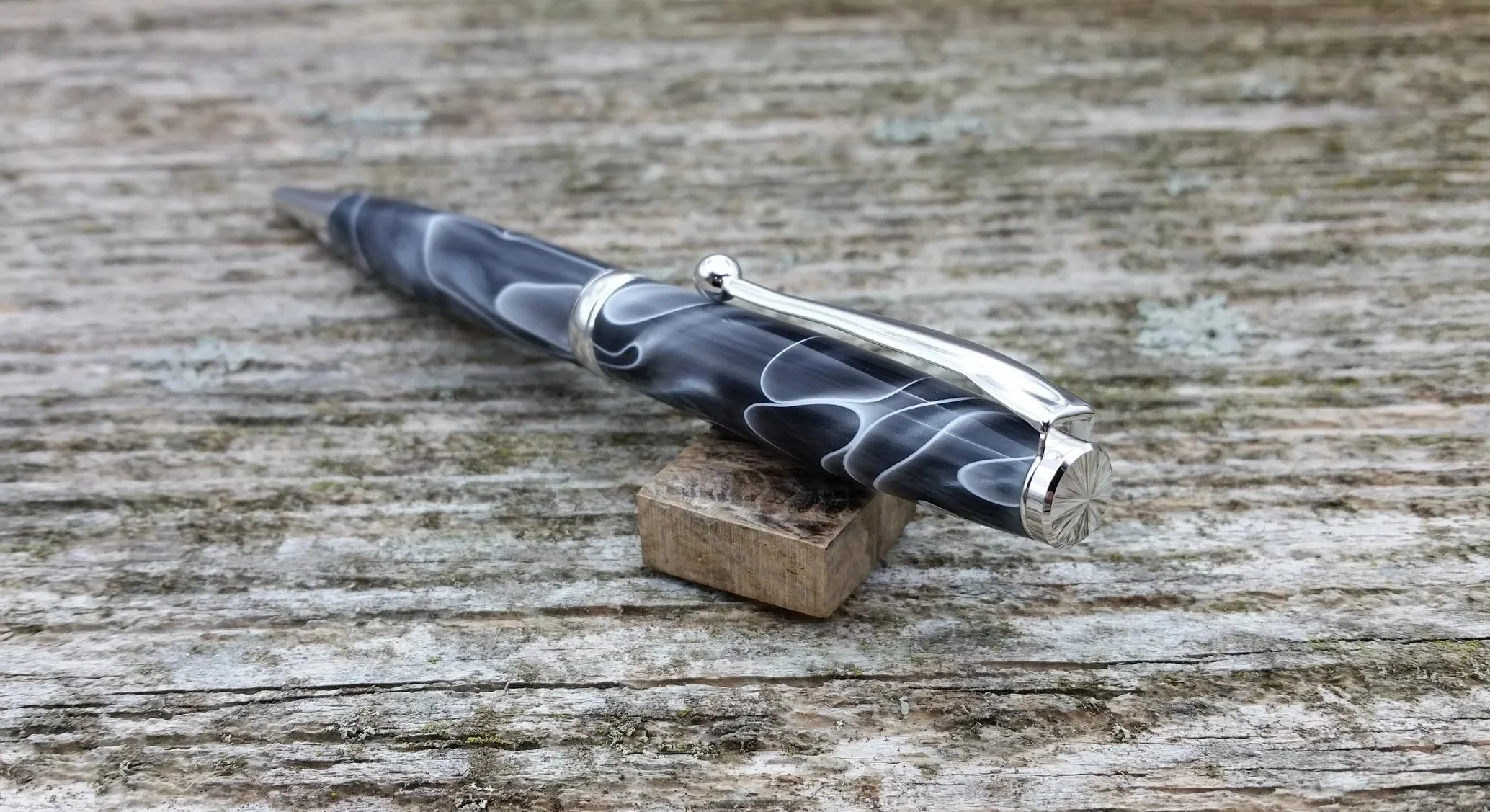 Parus Pen ballpoint twist pen with rhodium hardware and smokey black resin end view