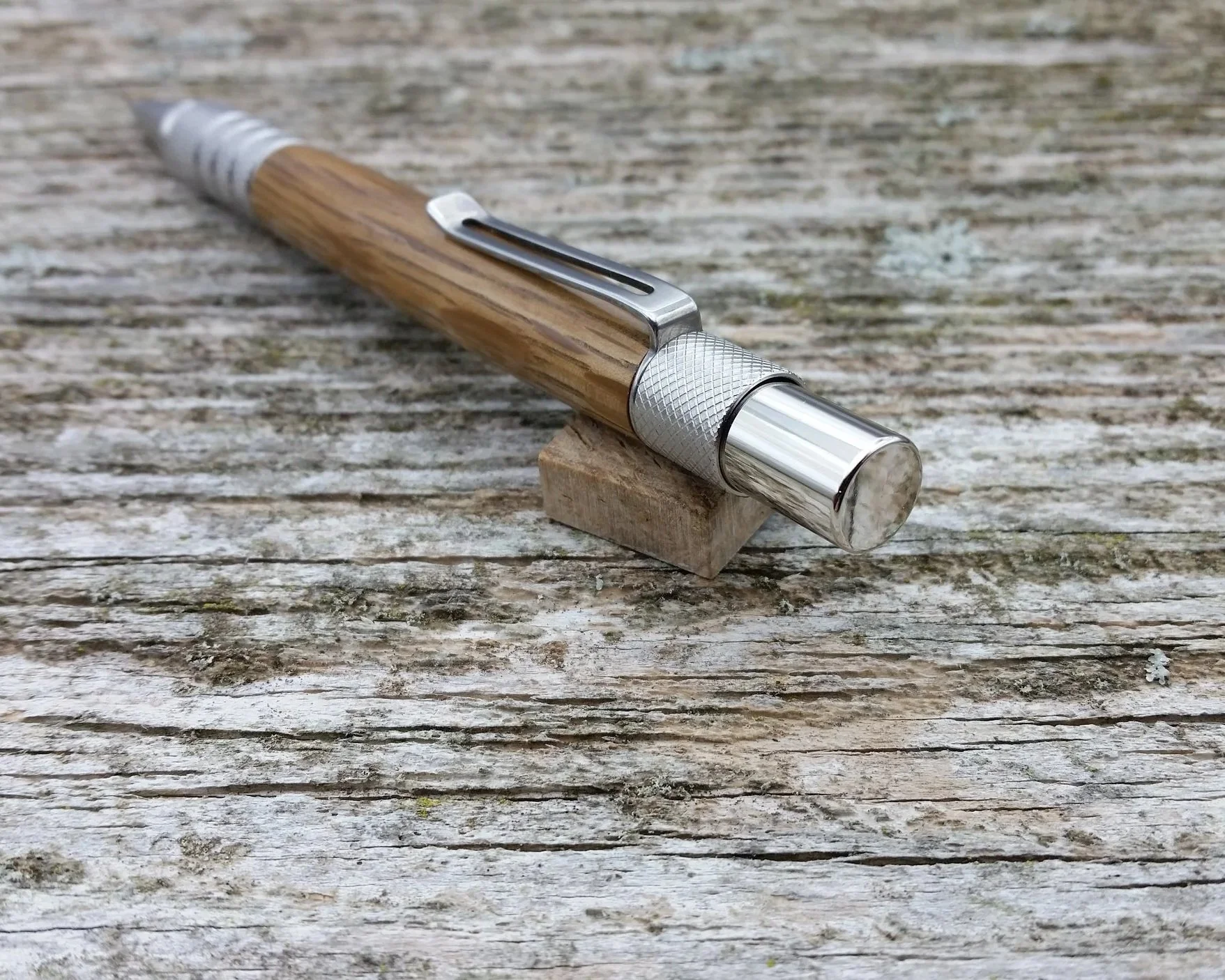 Parus Pen pencil with solid stainless steel and Jack Daniel's oak end view