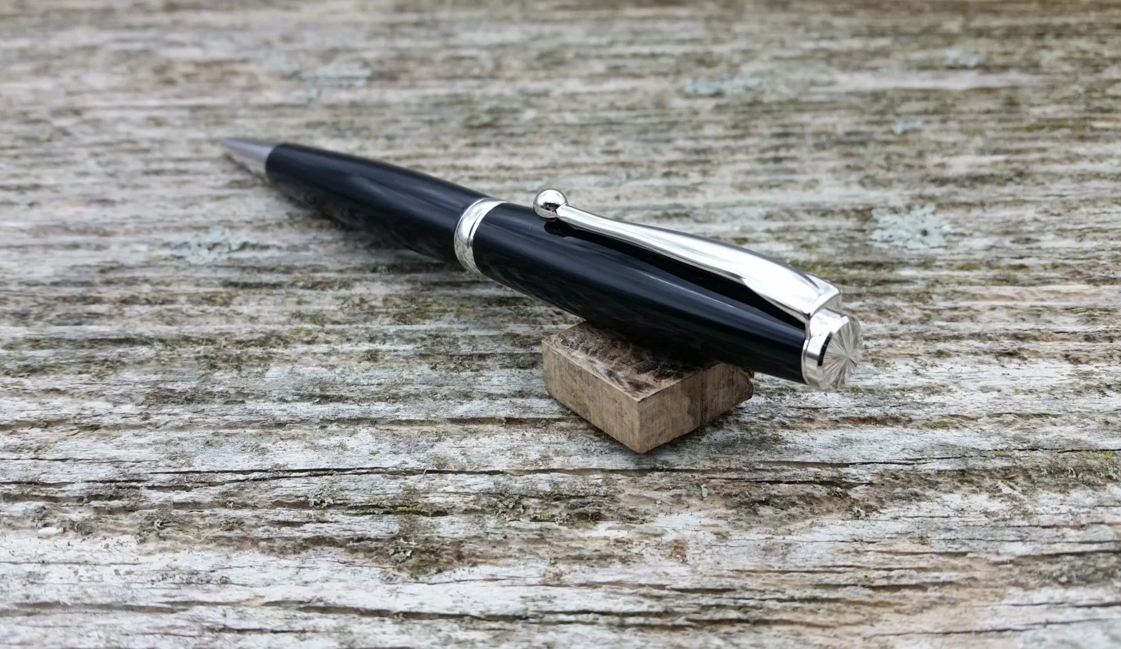 Parus Pen ballpoint twist pen with rhodium hardware and black resin end view