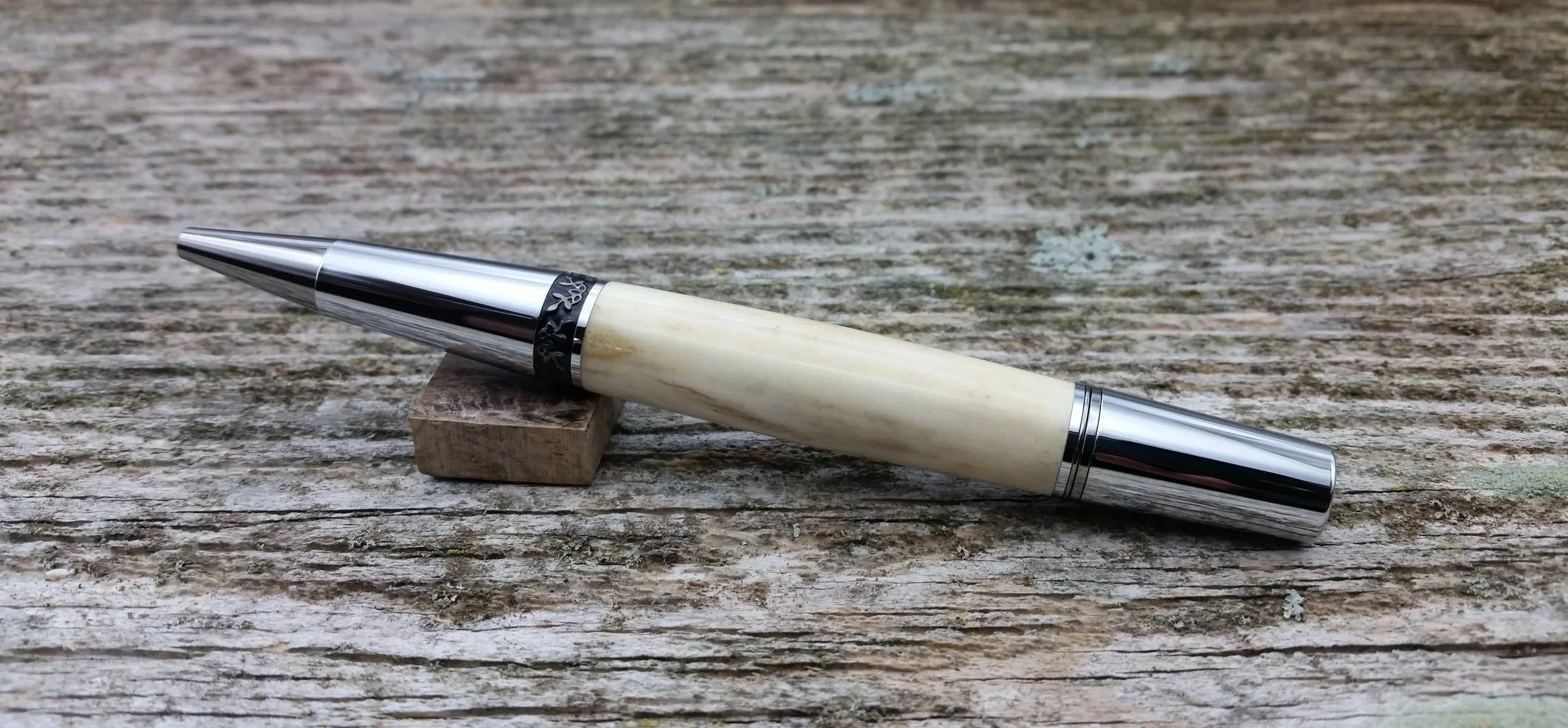 Parus Pen ballpoint twist pen with black titanium and chrome hardware and axis deer antler rear view