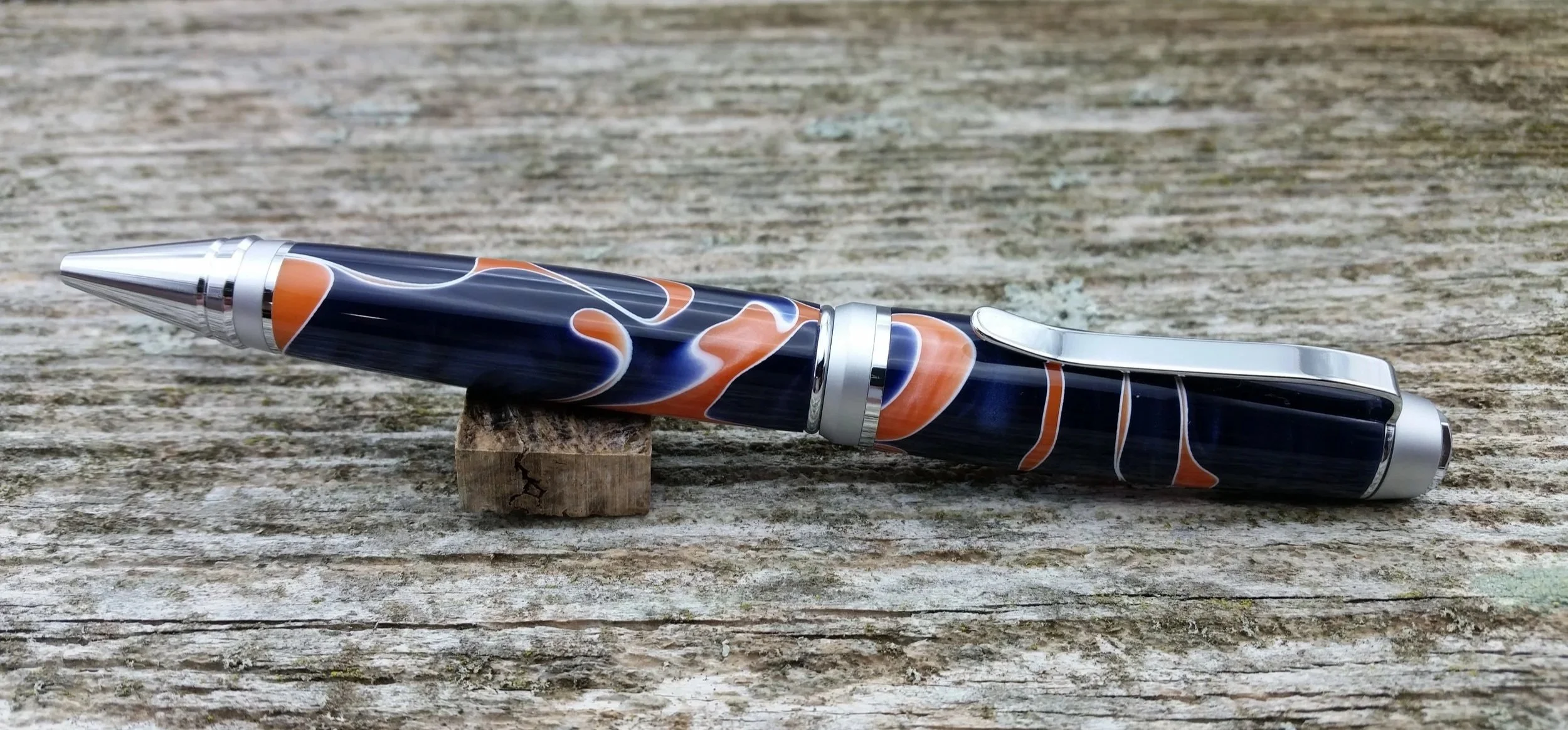 Parus Pen ballpoint twist pen with chrome hardware and blue, orange, white resin clip view